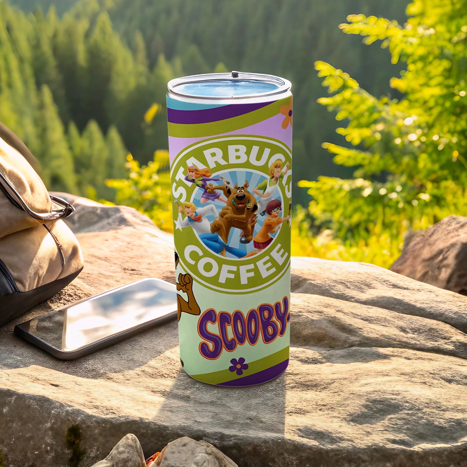 Scooby-Doo characters on a green and purple coffee tumbler with "Scooby Coffee" text.