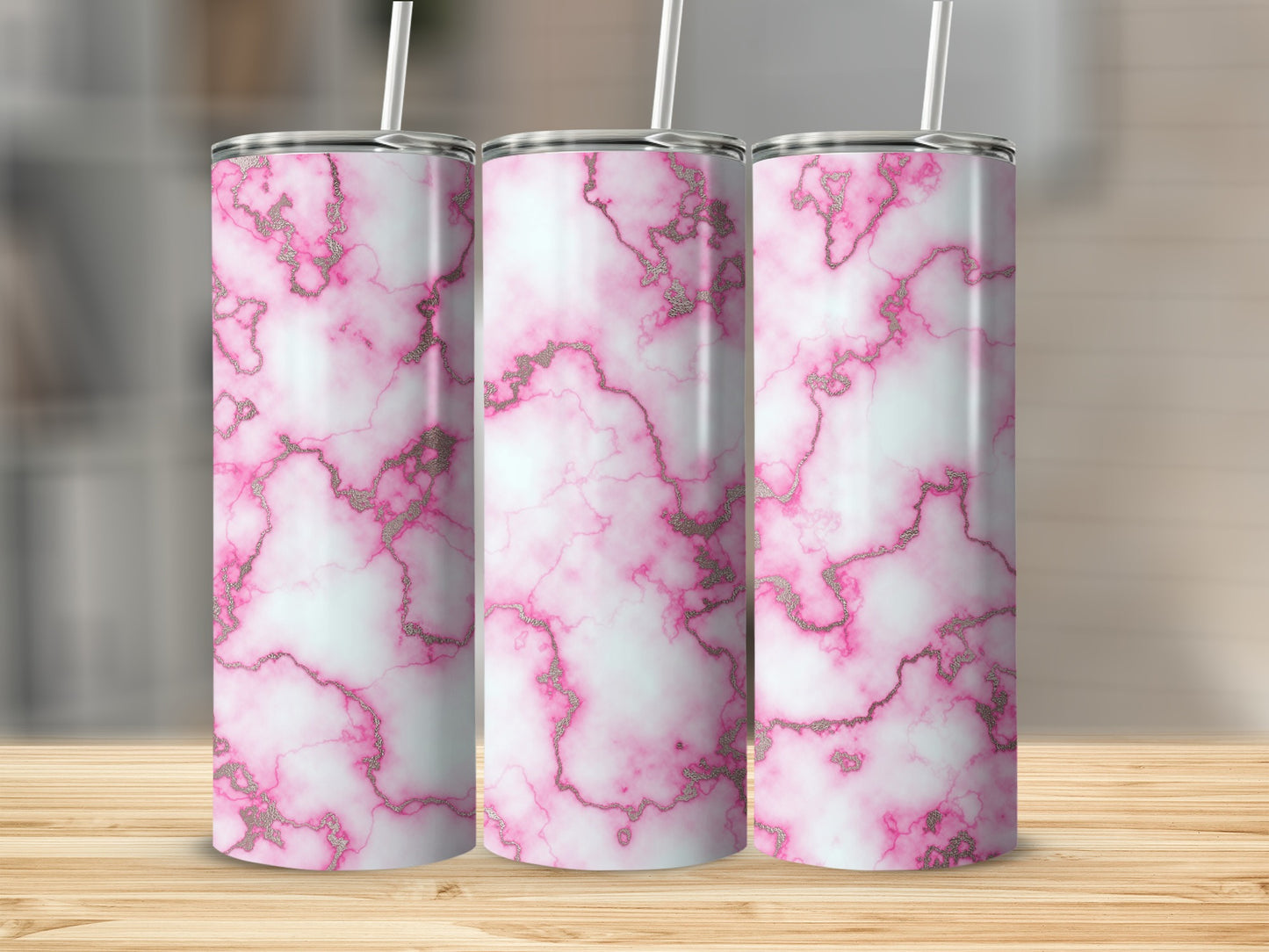Three tumblers with pink and white marble pattern and gold accents.