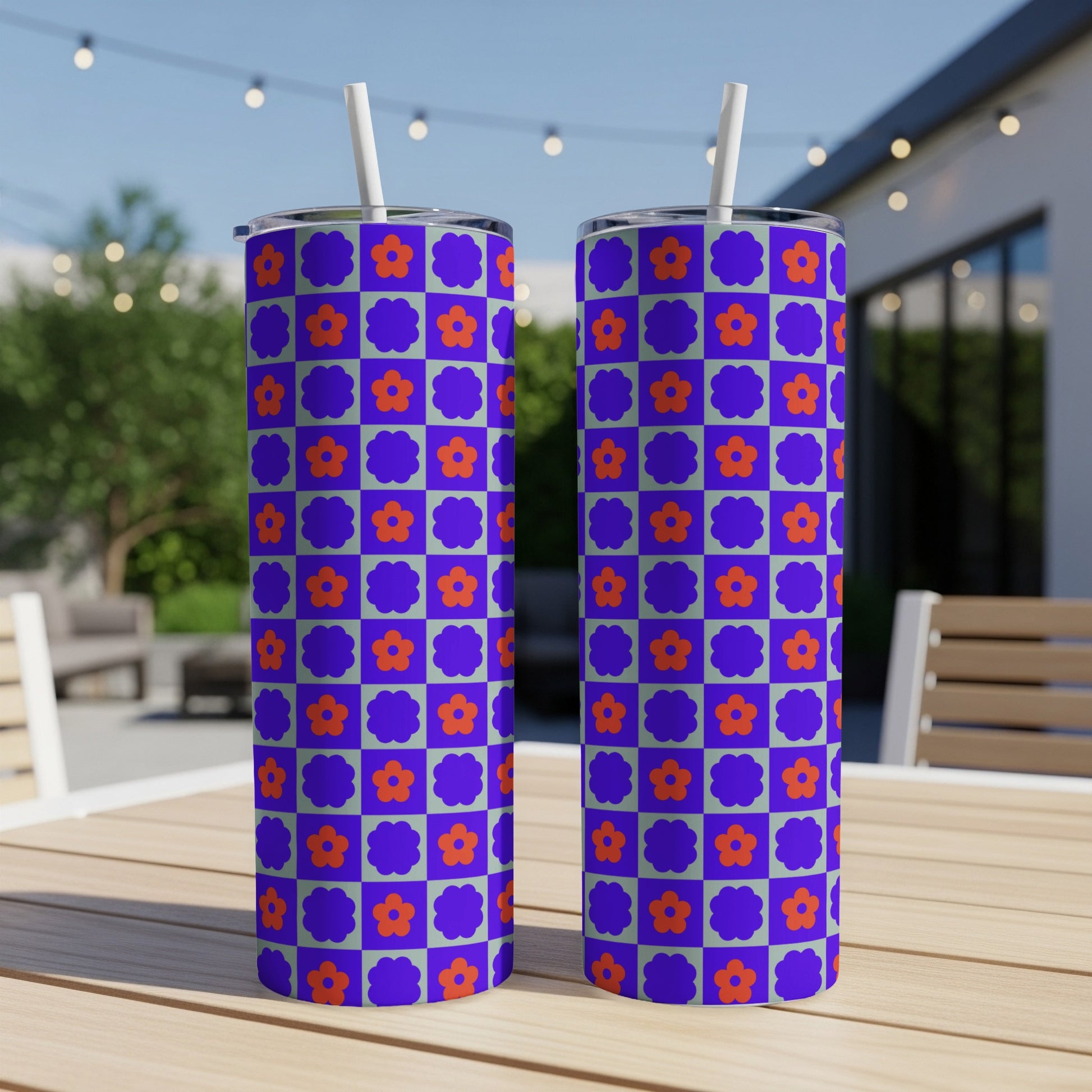Two tumblers with purple and orange checkerboard flower pattern.