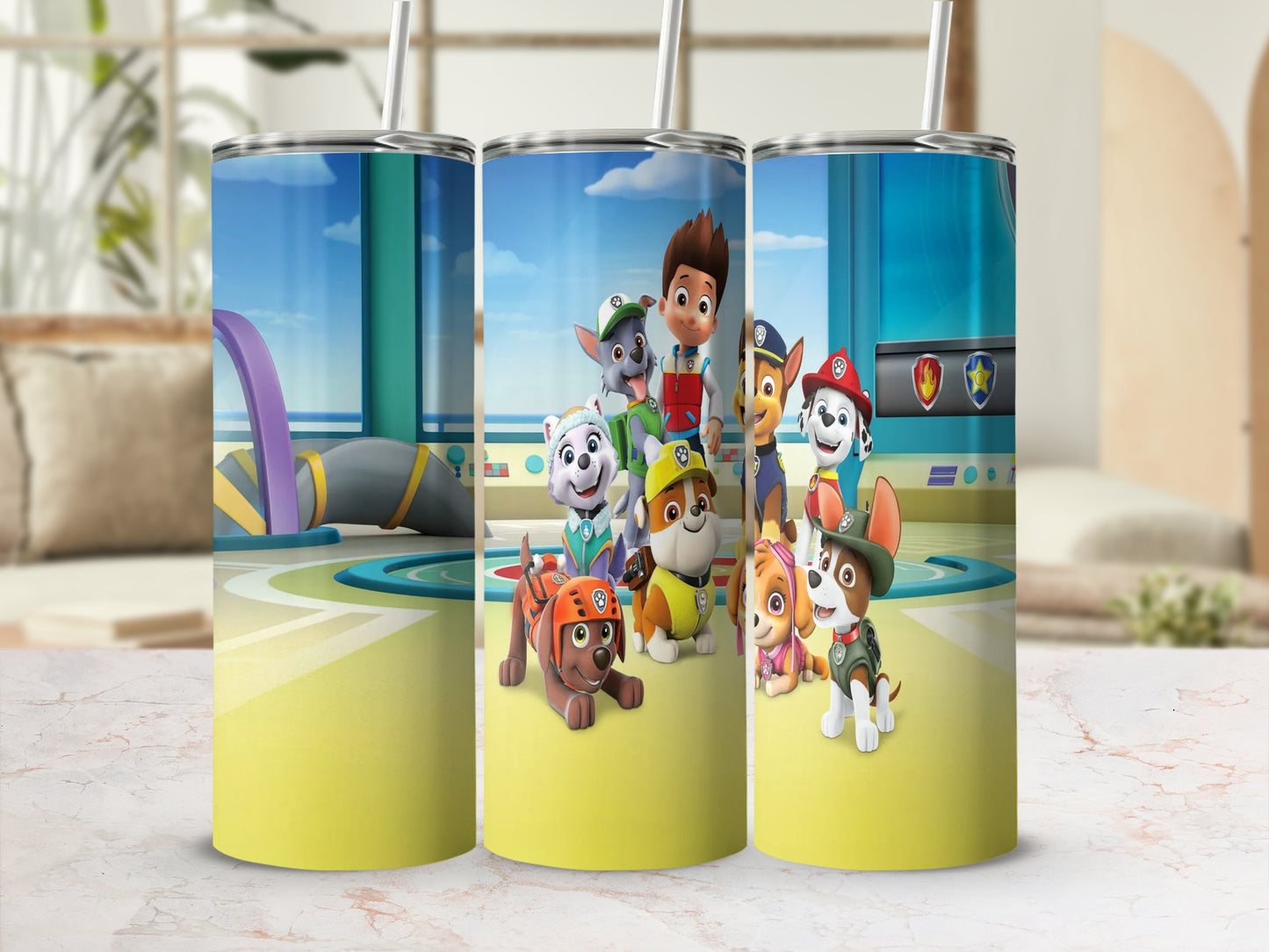 Paw Patrol characters on a yellow tumbler with a cityscape background.