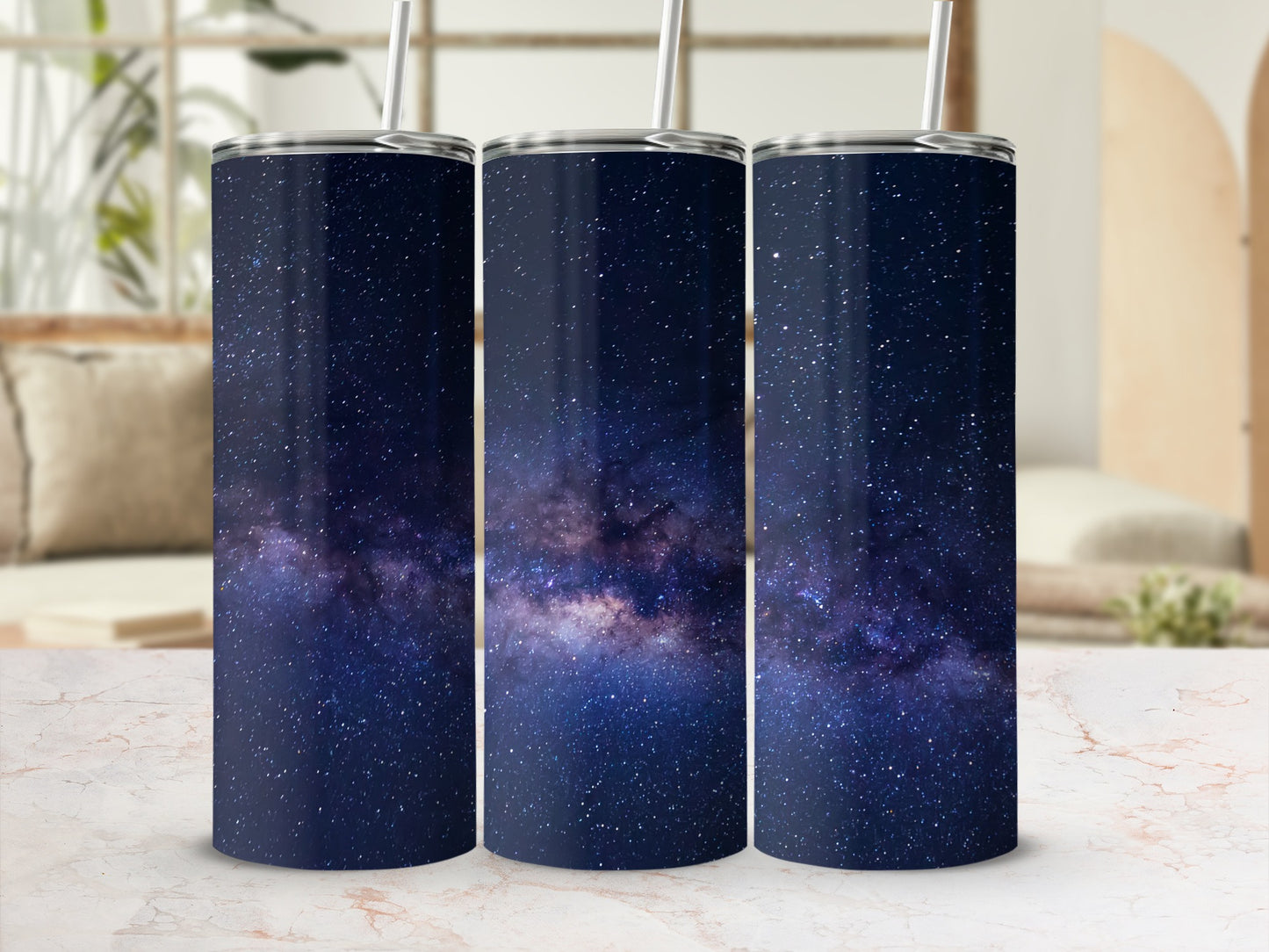 Three tumblers with a dark blue galaxy and star pattern.