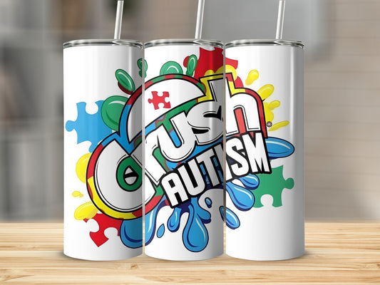 Tumbler with "Crush Autism" puzzle piece logo and colorful splashes.