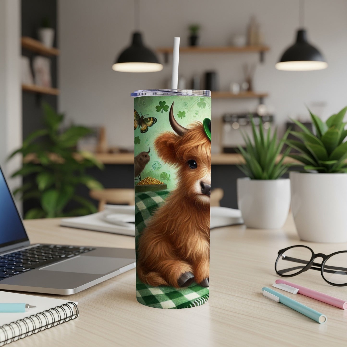 Highland cow with shamrock hat and butterflies on a green checkered background.