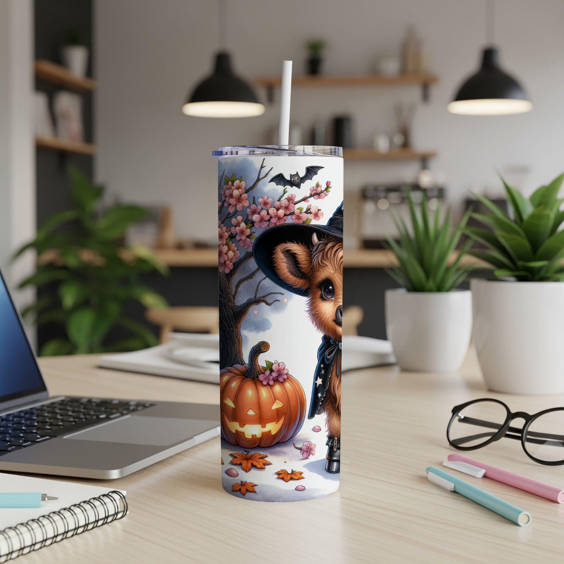Cute Halloween cow illustration on a tumbler with pumpkin and bat.