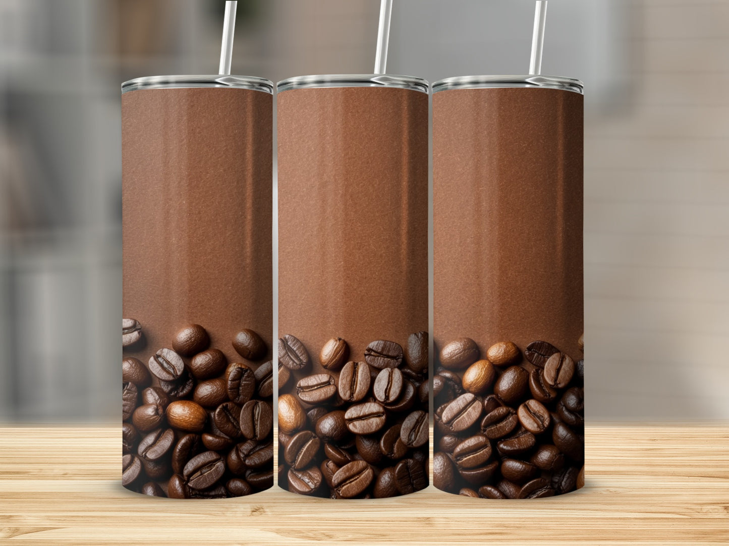 Three brown tumblers with coffee beans at the bottom.