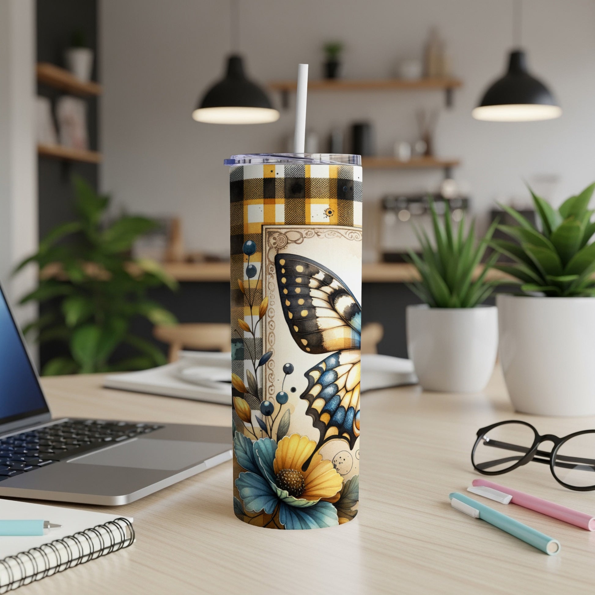 Tall tumbler with butterfly and floral design on yellow and black plaid.