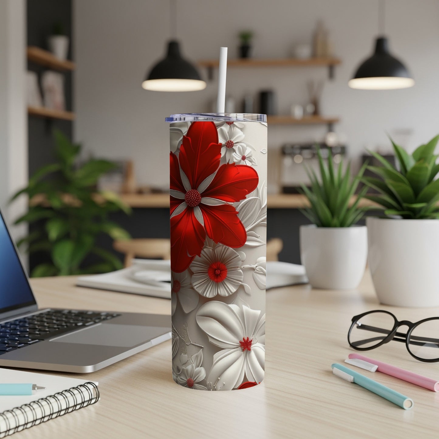 White tumbler with raised red and white floral pattern, white straw.