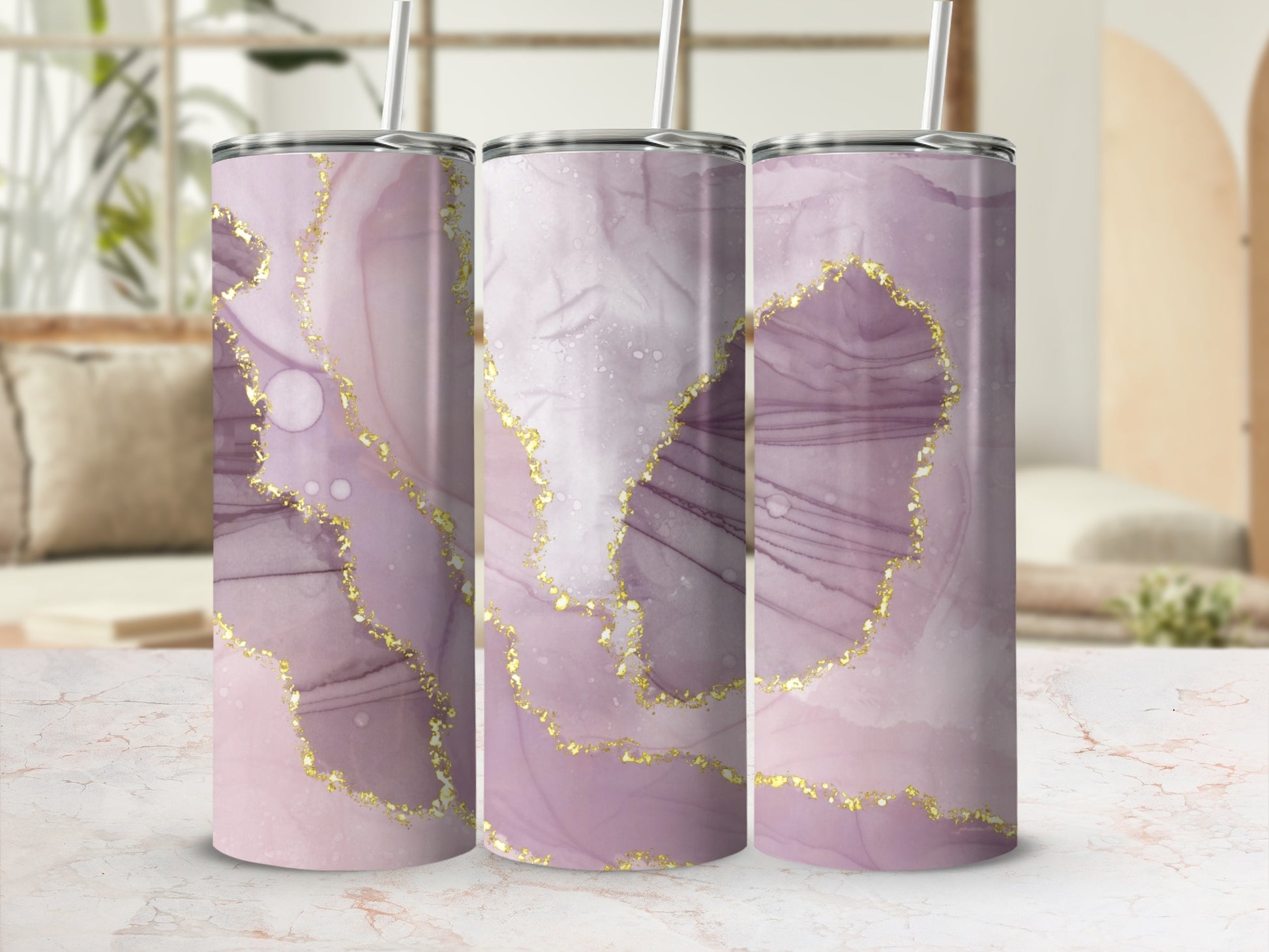 Three tumblers with pink and purple marble design and gold accents.