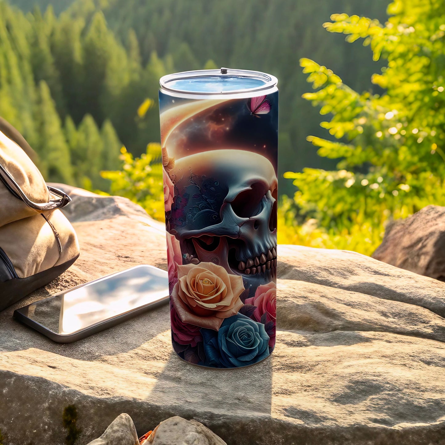 Tumbler with skull and roses design, set against a scenic forest background.