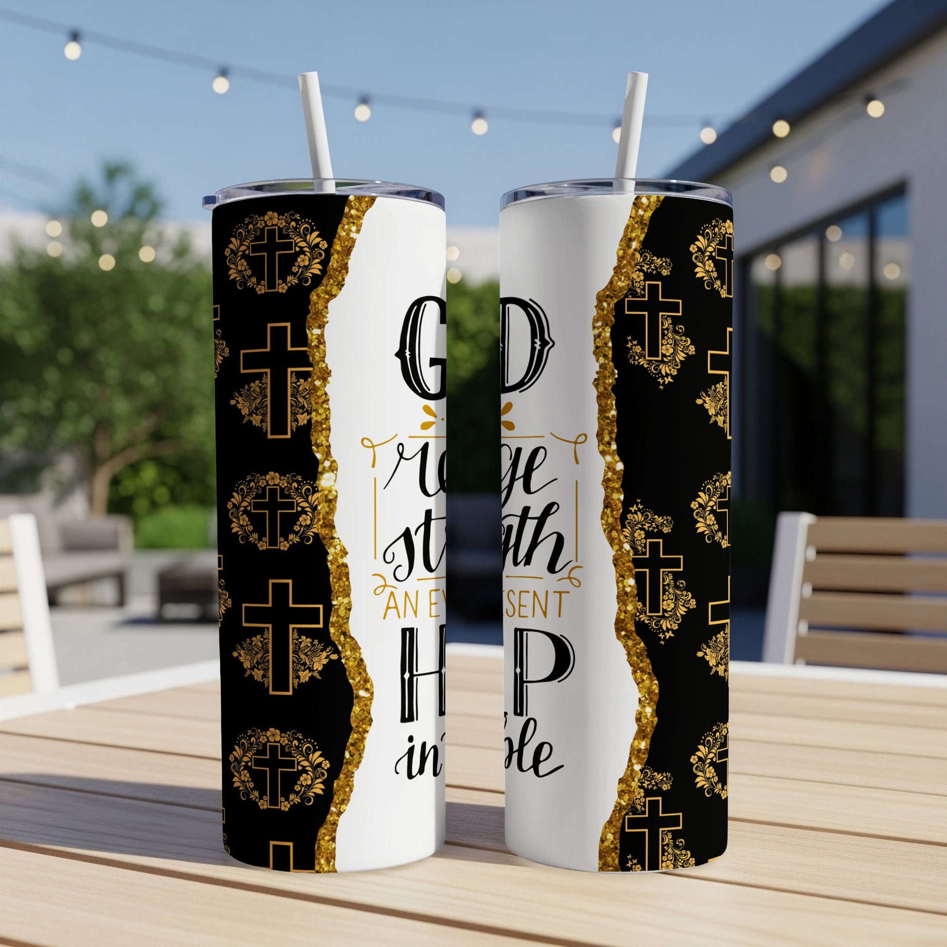 Tumbler with "God is my strength" text and cross designs.