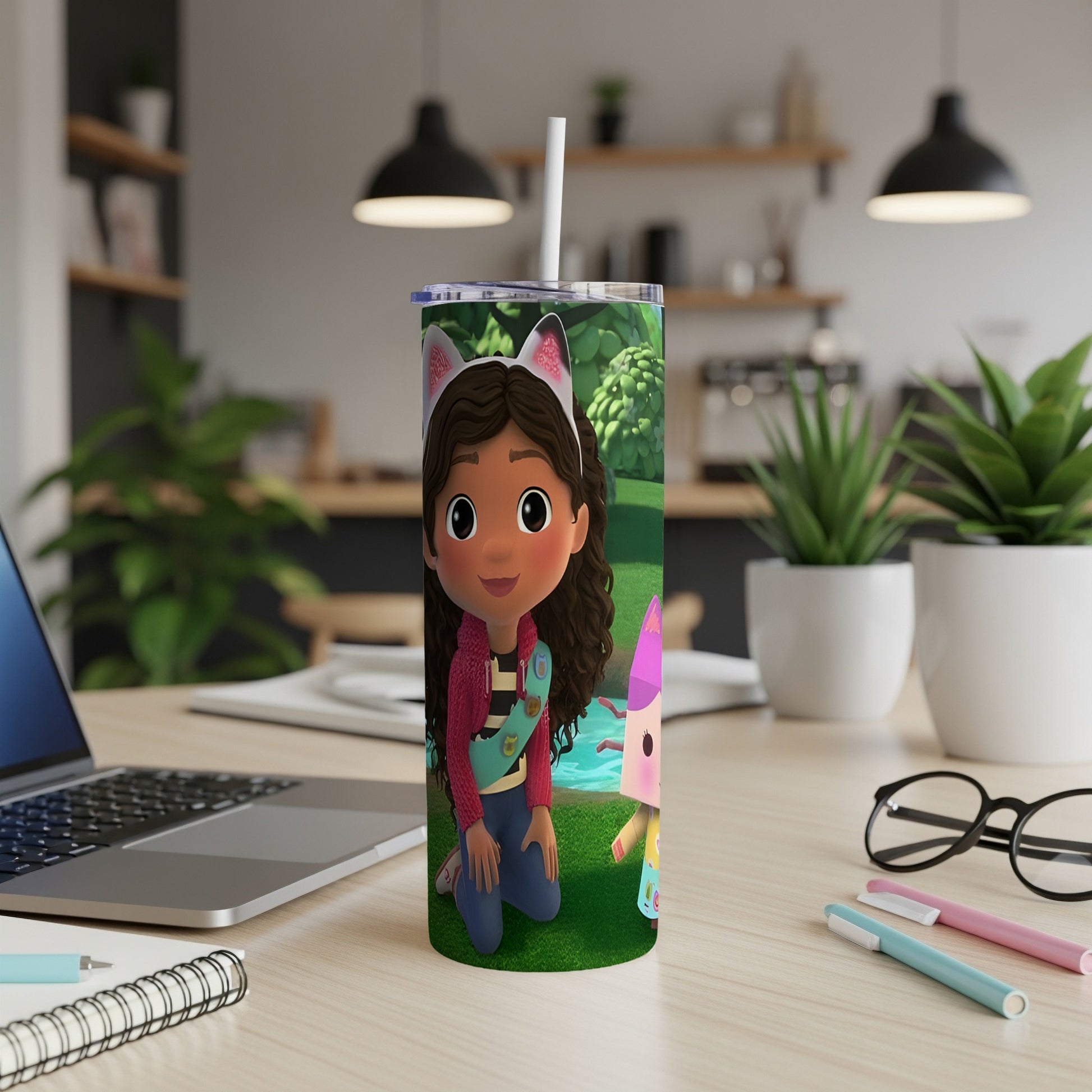 Gabby's Dollhouse character Kneesaa on a pink and green tumbler with straws.