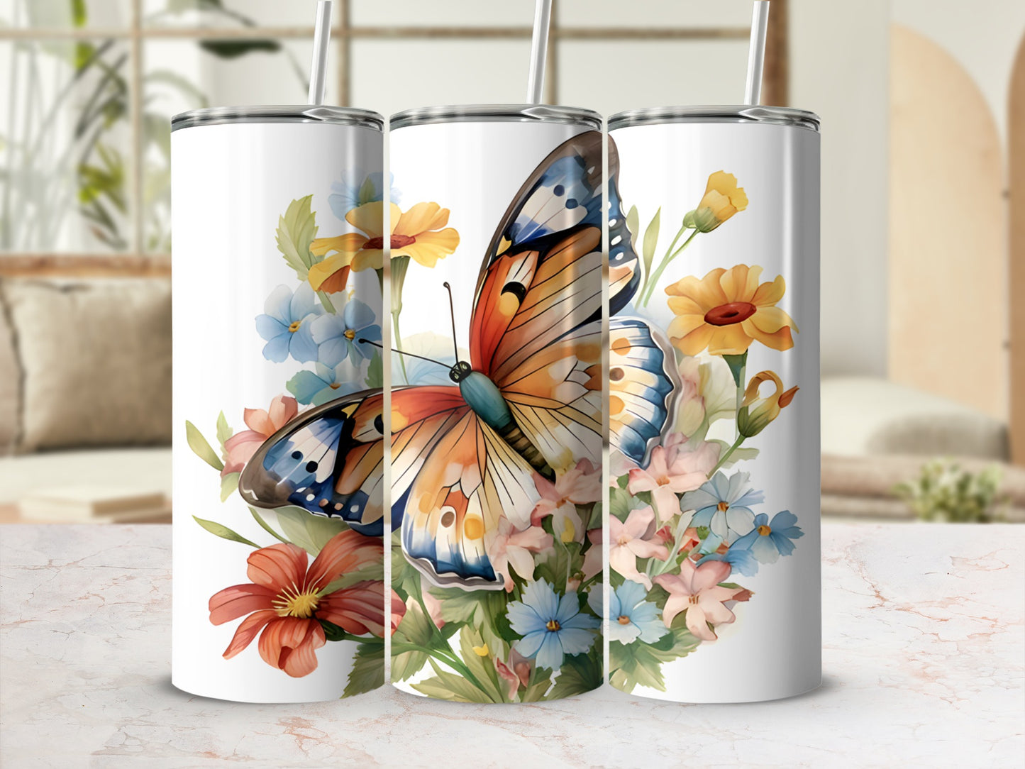 Three tumblers featuring a colorful butterfly and floral design.