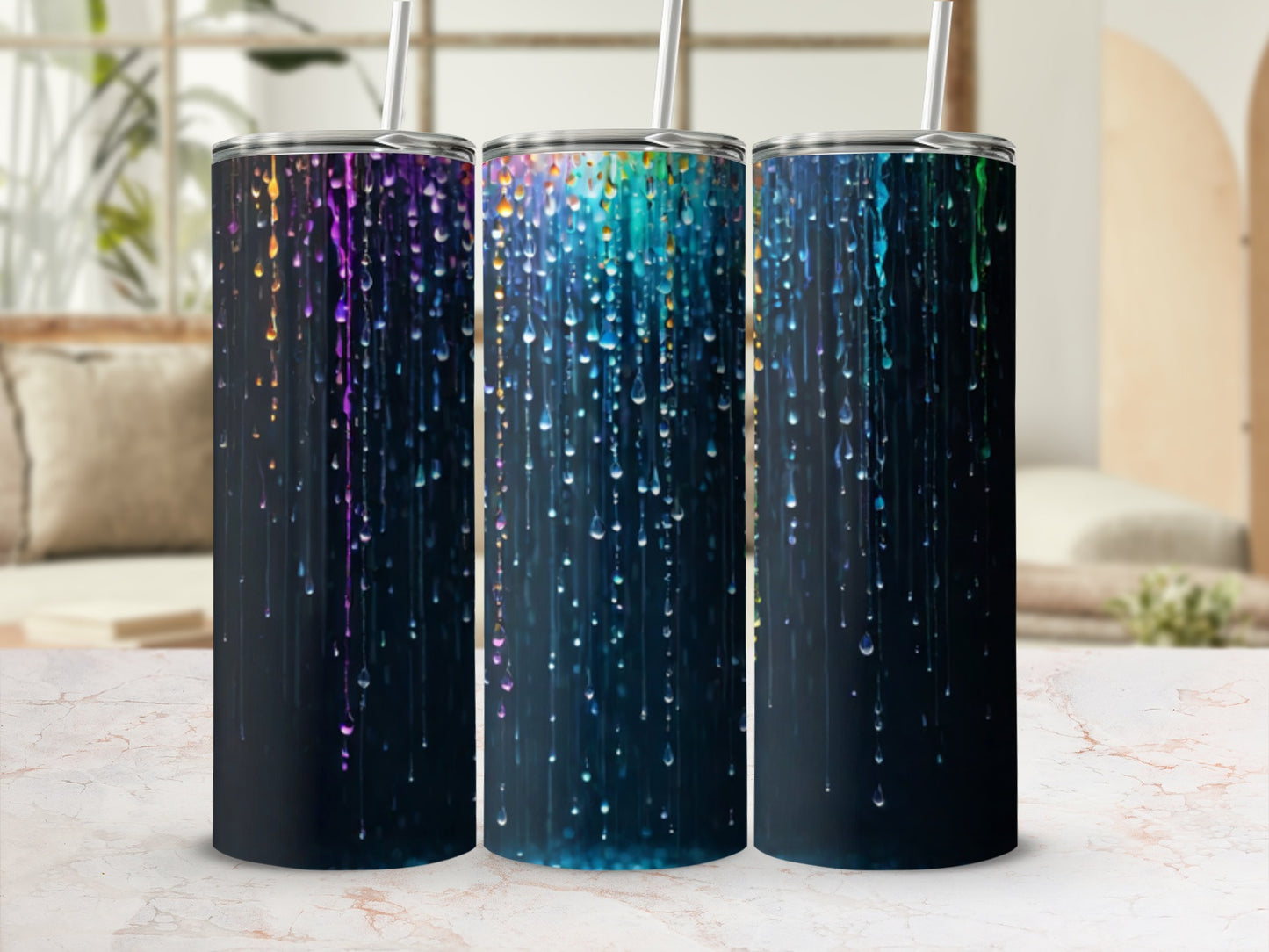 Three tumblers with colorful, dripping paint-like design.