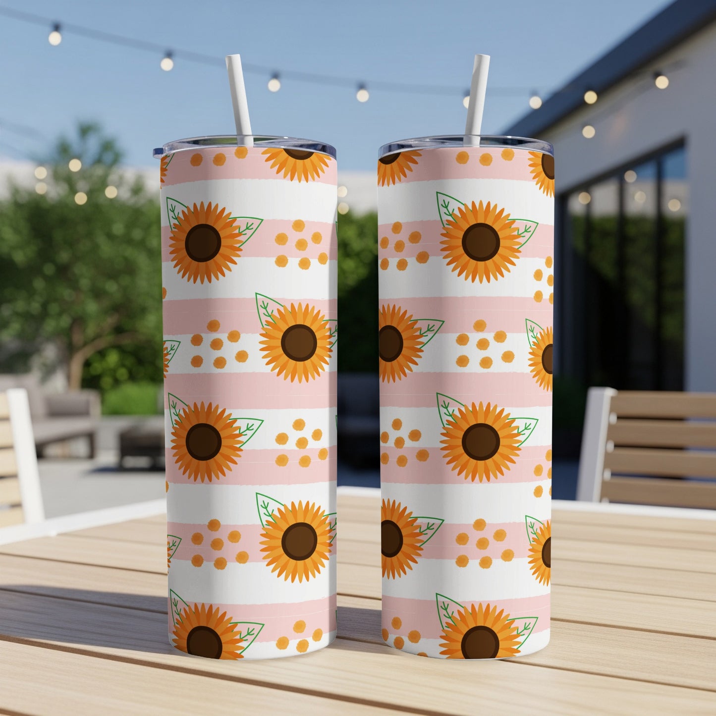 Two tumblers with sunflowers and orange dots on pink and white stripes.