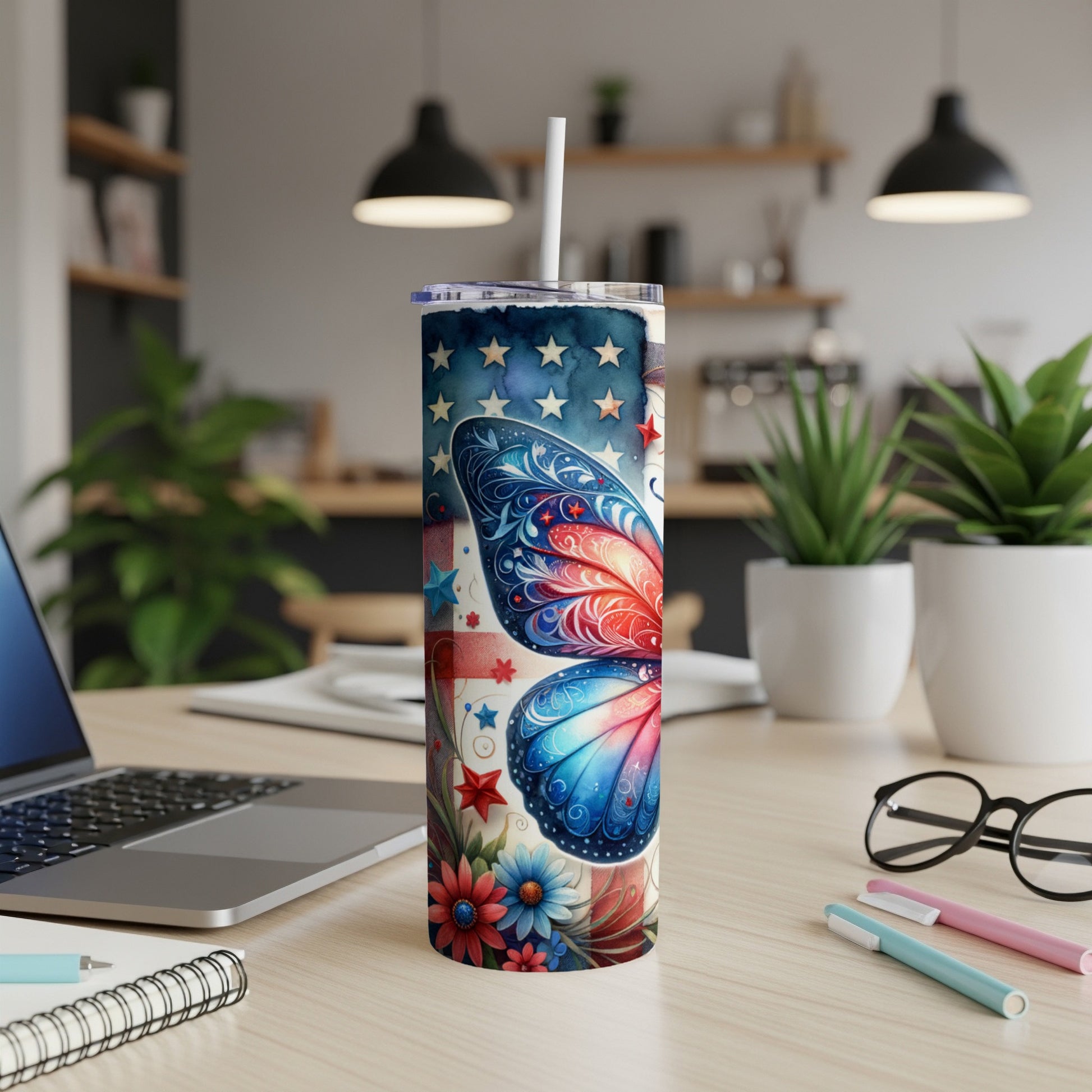 Red, white, and blue butterfly tumbler with patriotic stars and flowers.