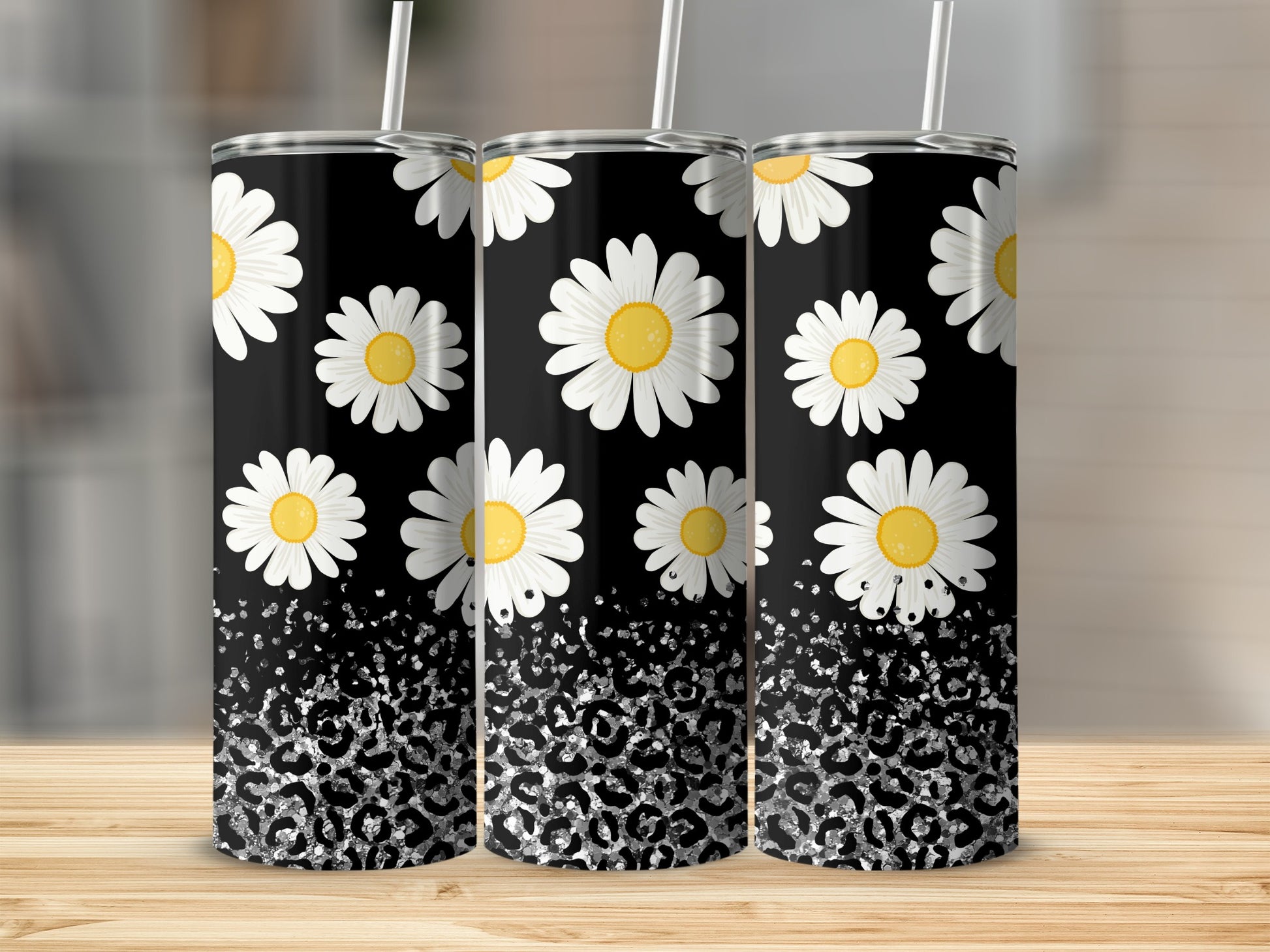 Black tumbler with white daisies and silver leopard print.