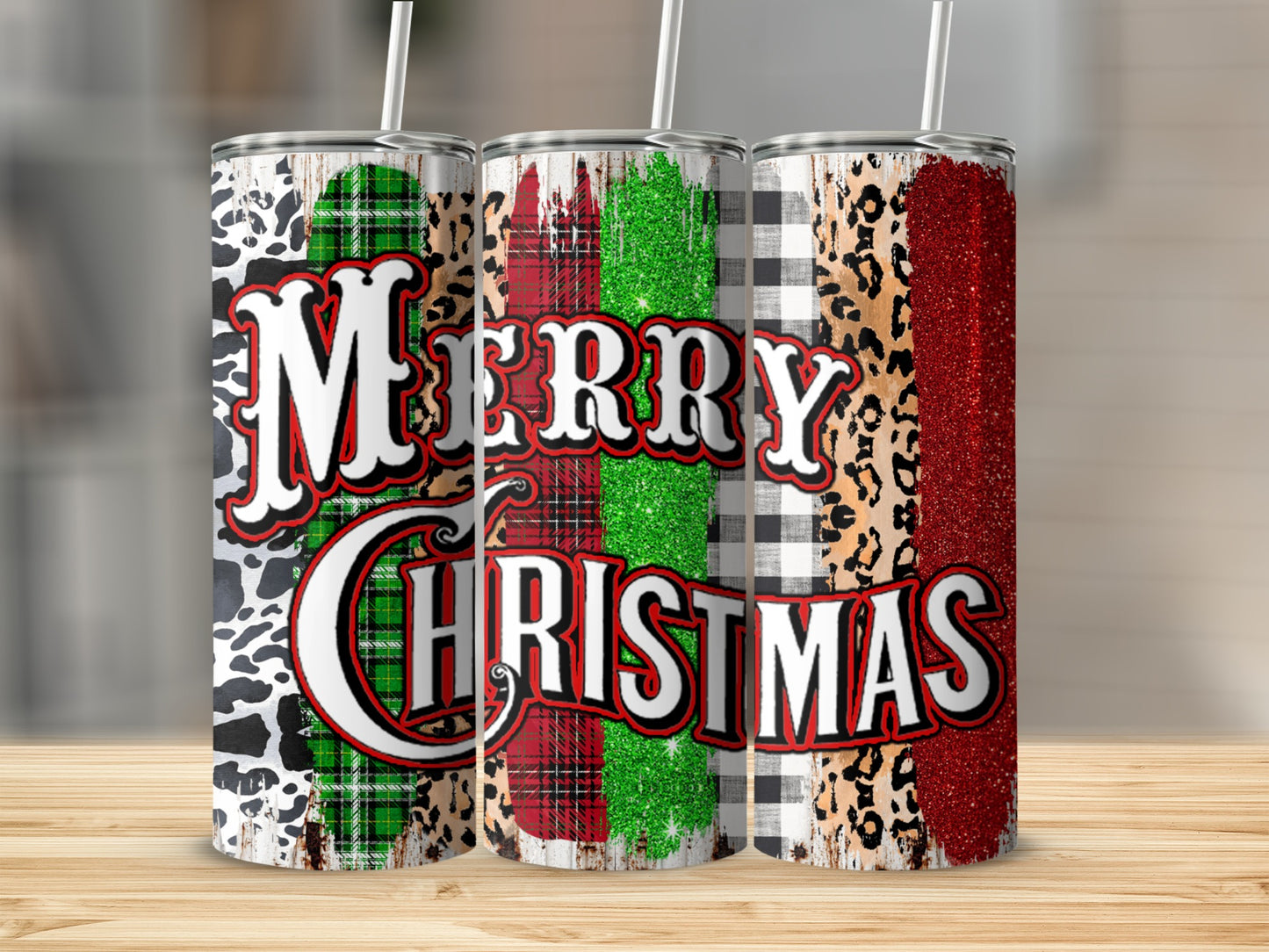 Three holiday tumblers with Merry Christmas text and plaid and animal prints.
