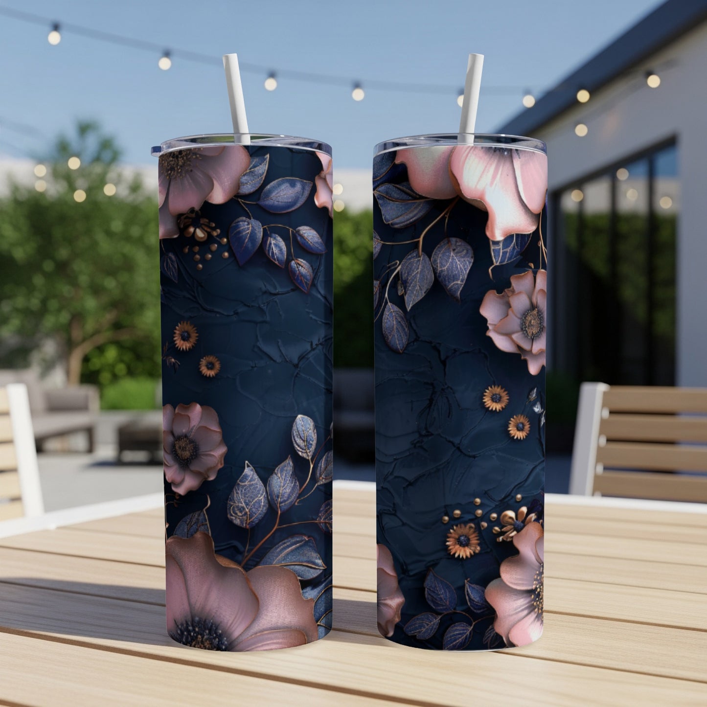Two tumblers with dark blue textured surface and pink floral design.