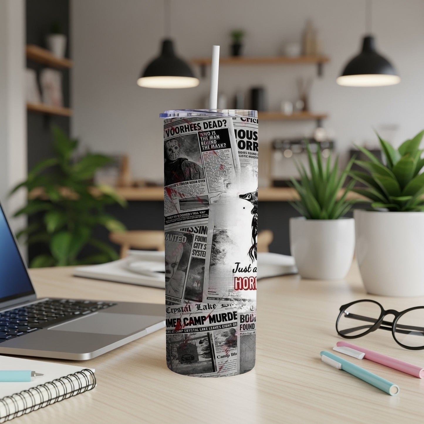 Tumbler with newspaper headlines about a killer and "Just a Hori".