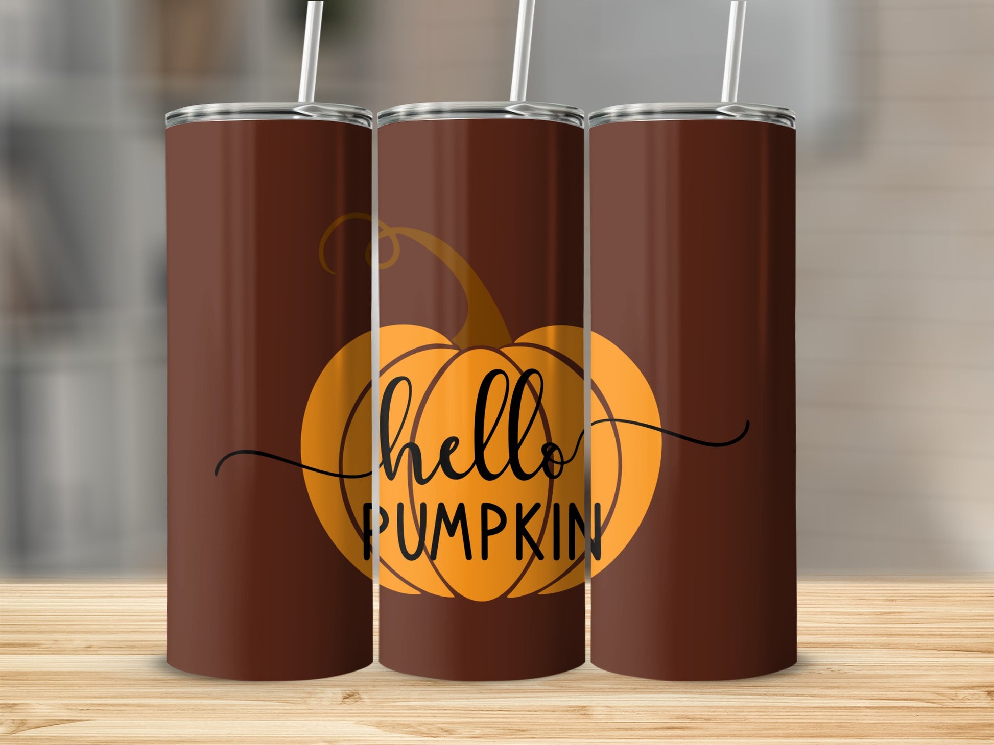 Brown tumbler with orange pumpkin and "hello pumpkin" text.