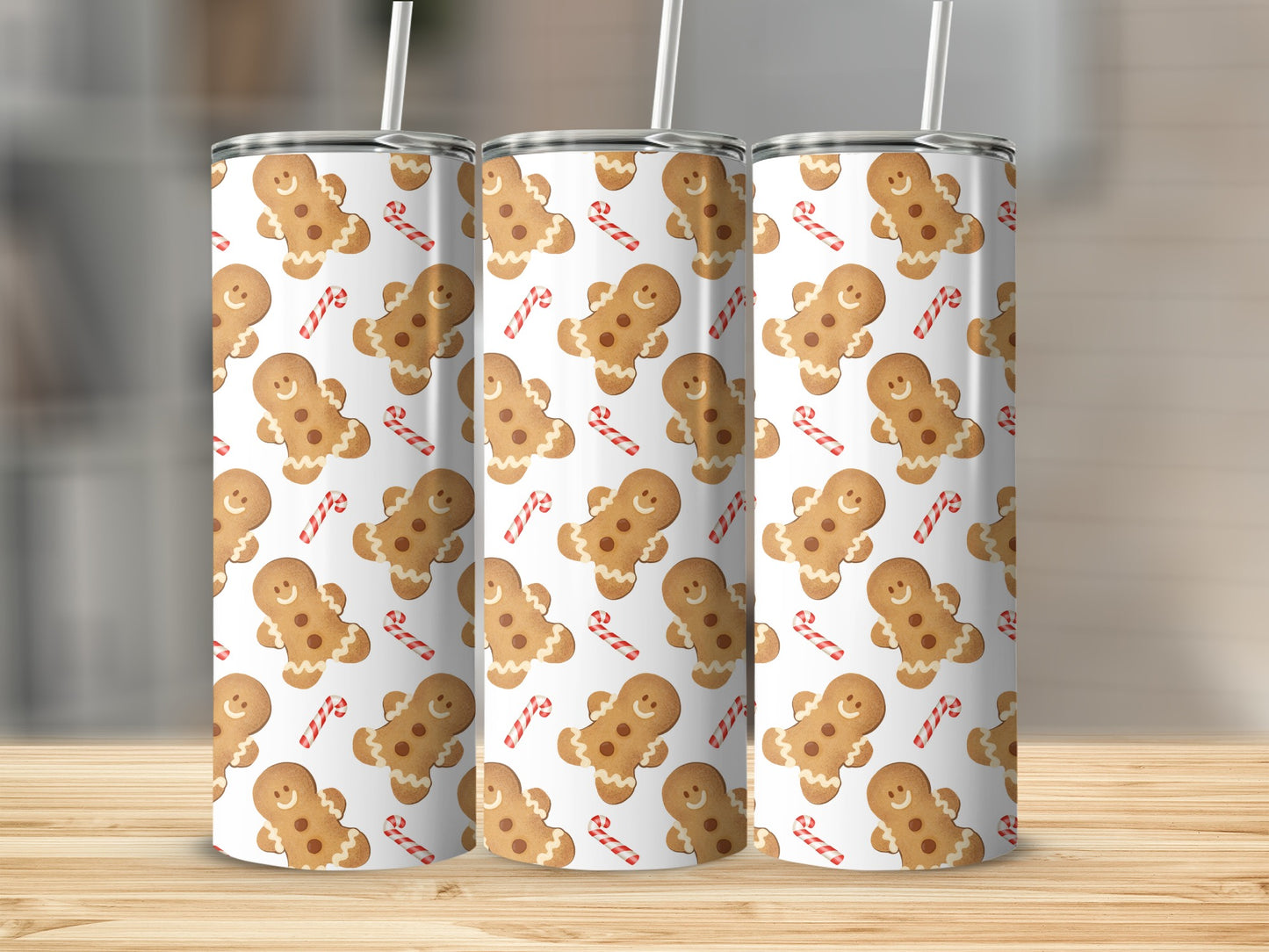 Gingerbread cookies and candy canes pattern on three tumblers.
