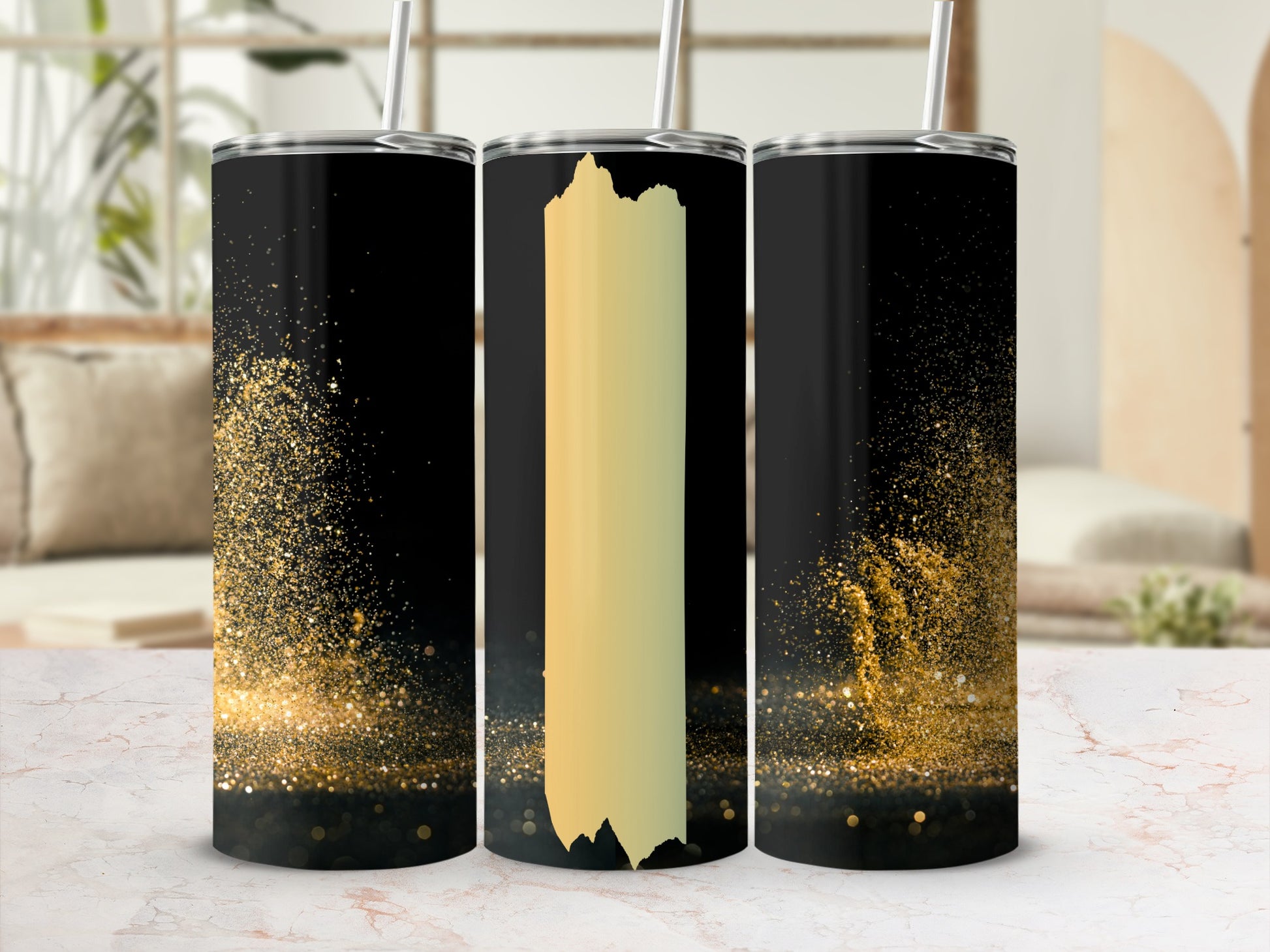 Black tumbler with gold glitter splatter and a vertical gold stripe.