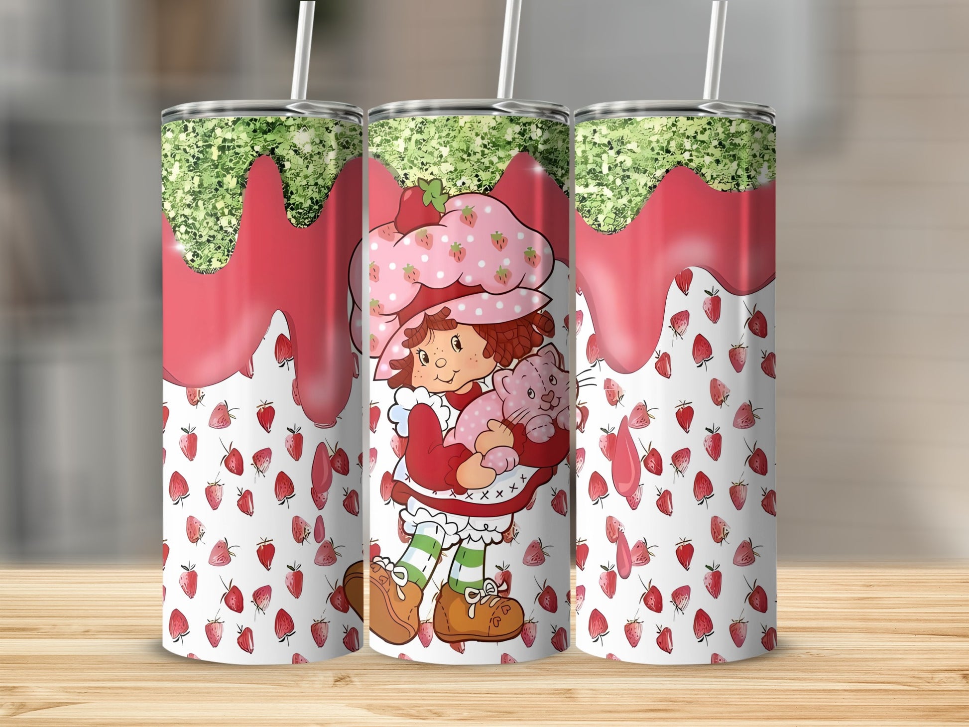 Strawberry Shortcake holding a pink cat, surrounded by strawberries.