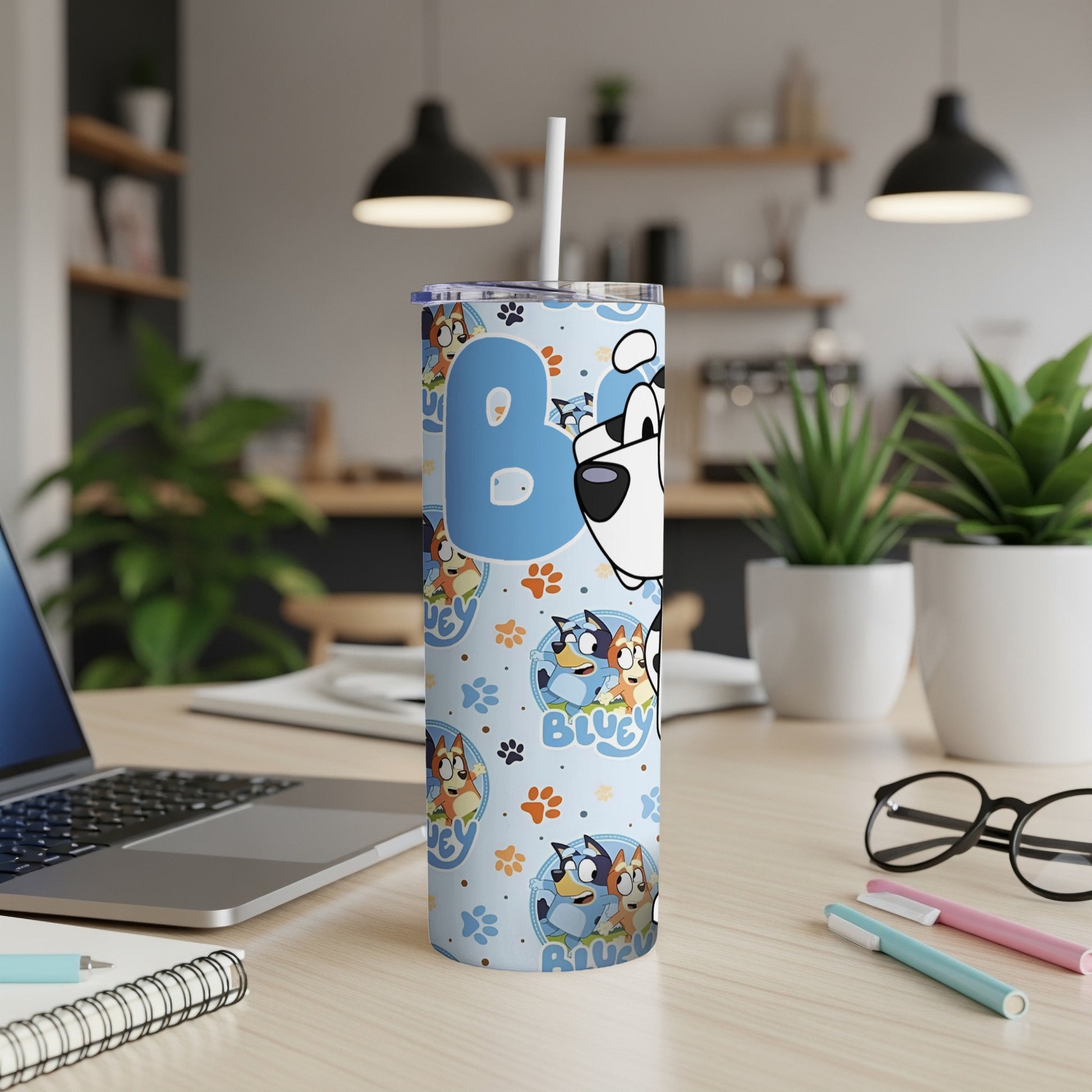 Bluey tumbler with straw, featuring Bluey characters and colorful patterns.