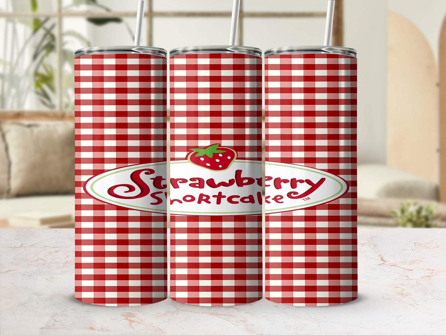 Red and white gingham tumbler with "Strawberry Shortcake" logo and strawberry graphic.