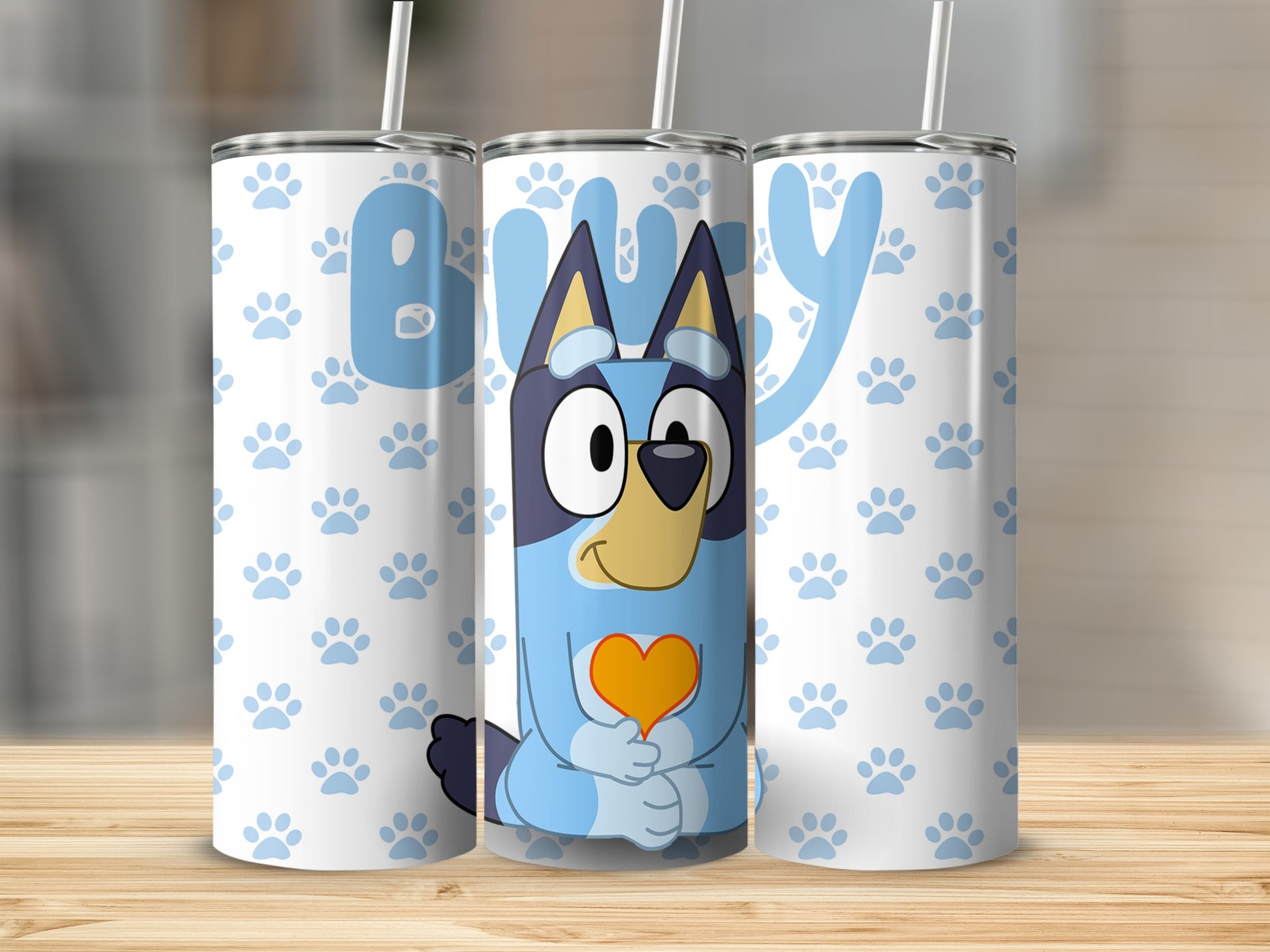 Bluey character holding an orange heart, with paw prints.