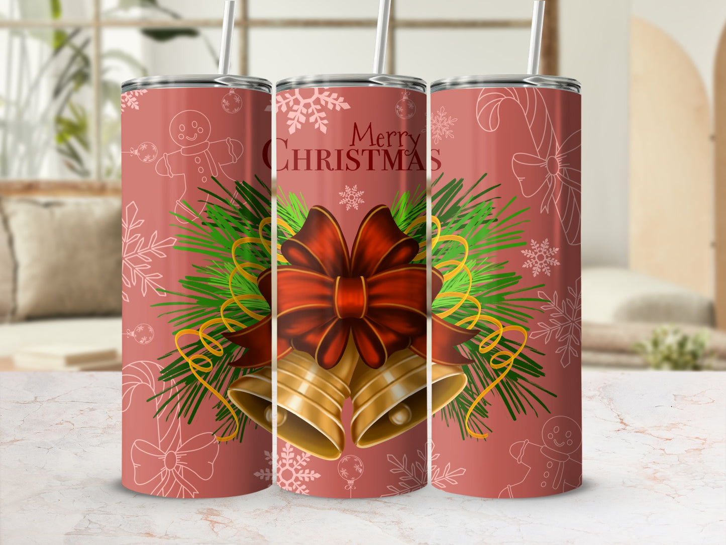 Christmas tumbler with bells, bow, snowflakes, and pine sprigs.