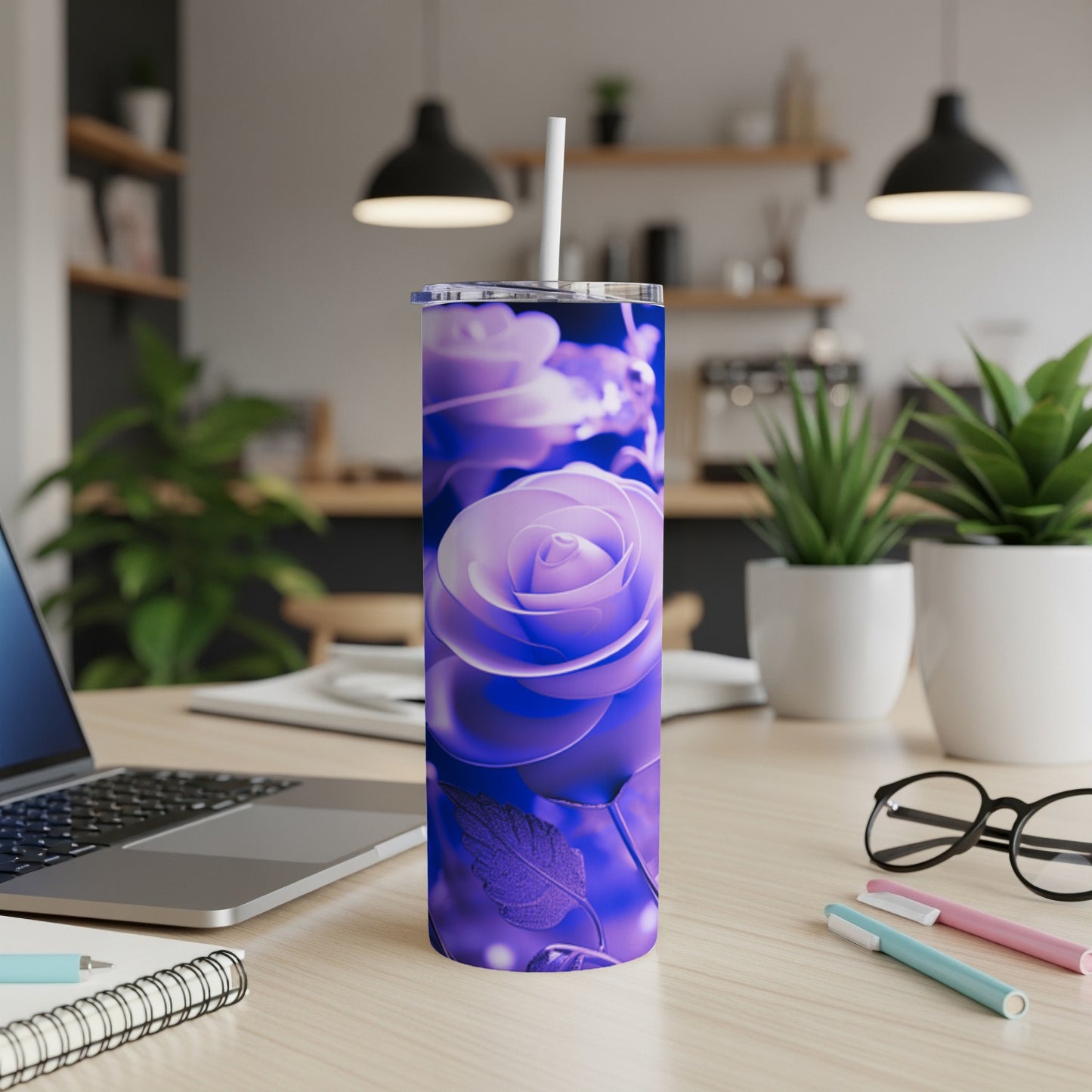 Purple rose design on a tall, slim tumbler with a straw.