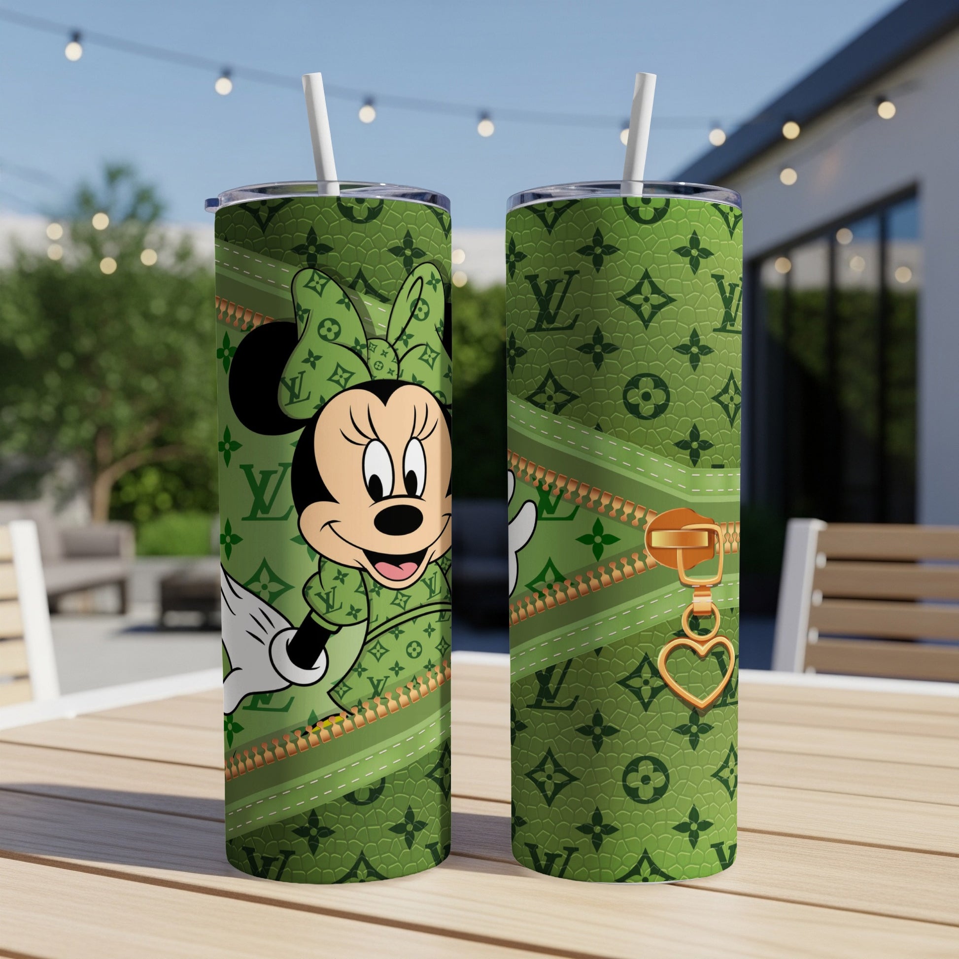Green tumbler with Minnie Mouse and LV-style pattern, gold zipper detail.