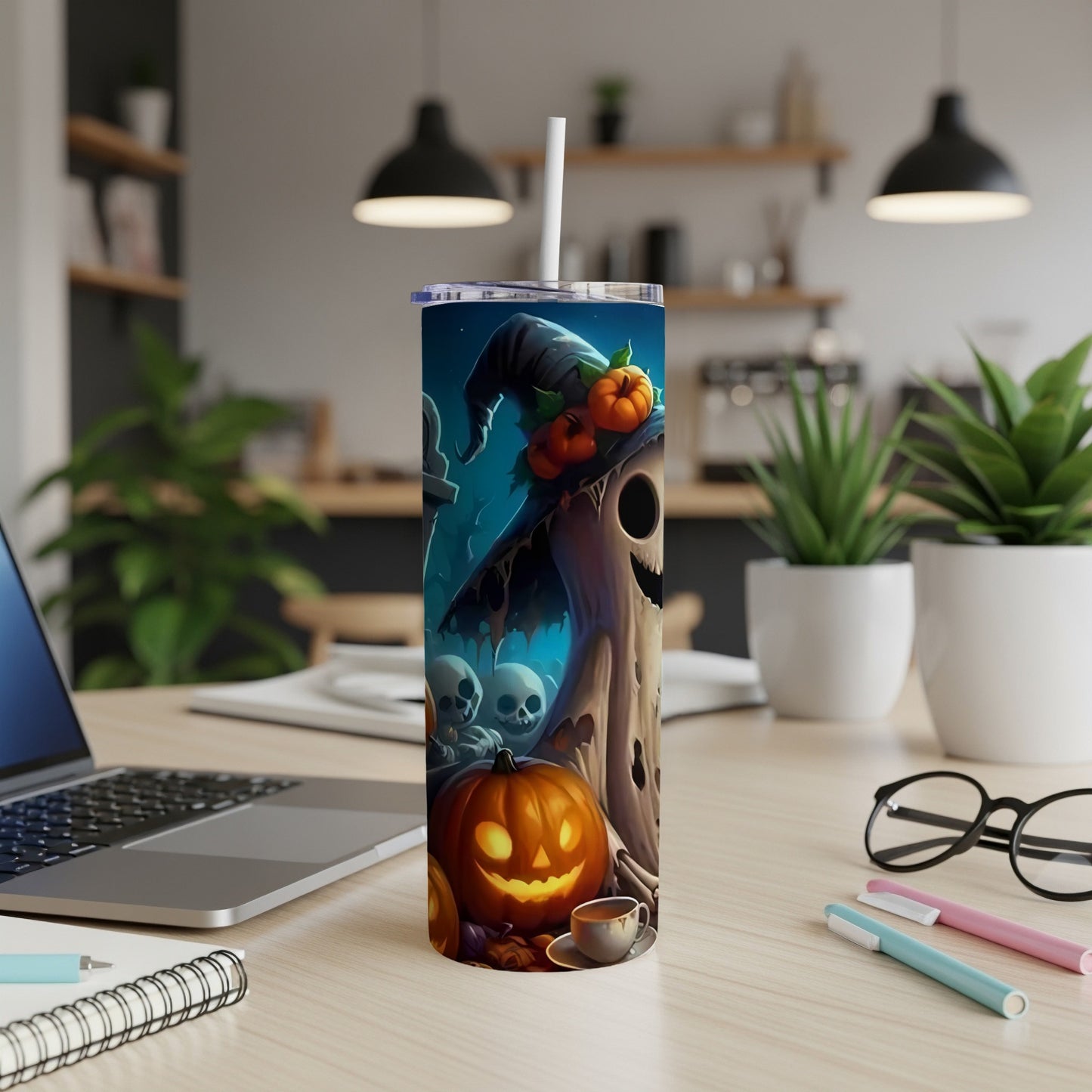 Halloween tumbler featuring a ghost in a witch hat with pumpkins and skulls.