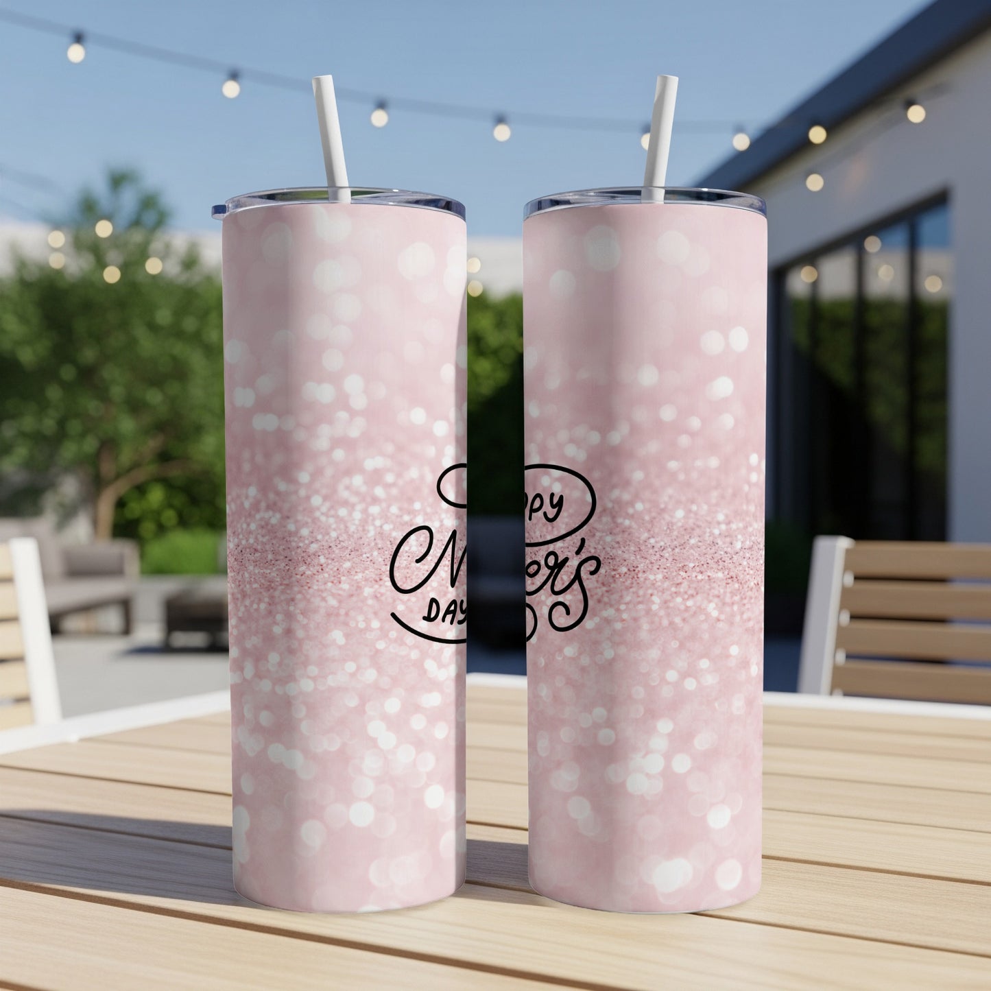 Pink glitter tumbler with "Happy Mother's Day" text on a table.