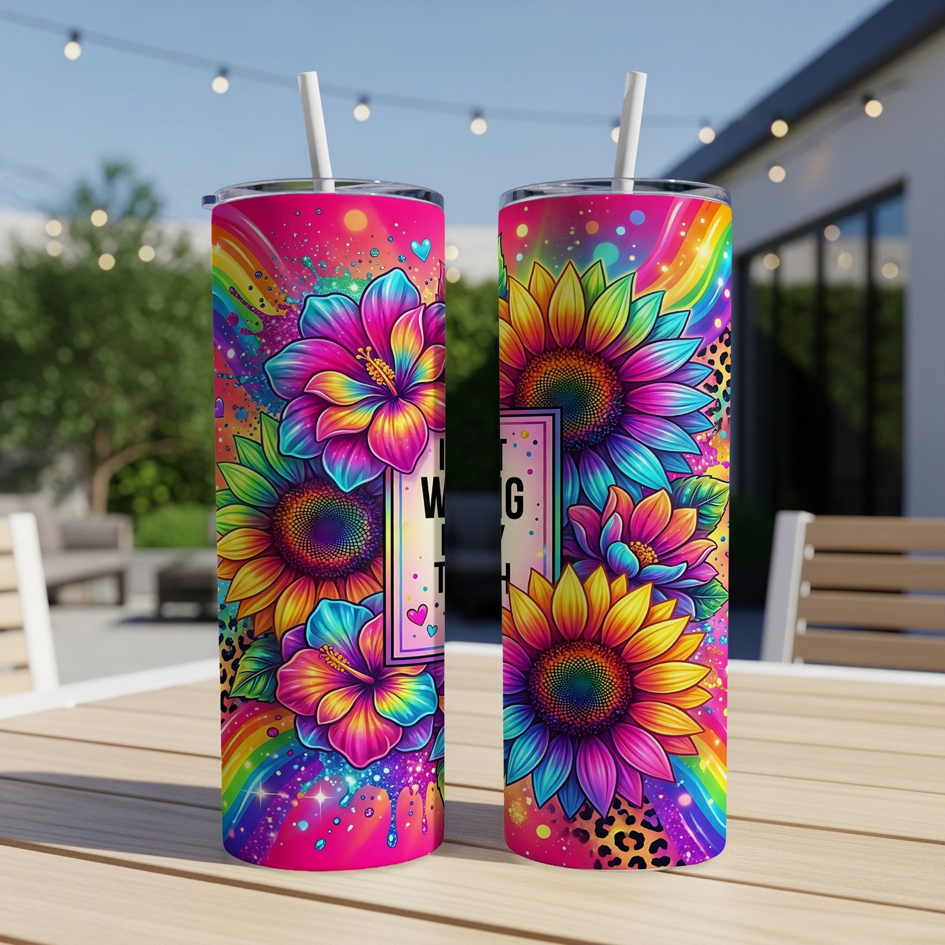 Two tall tumblers with rainbow sunflower and floral designs.