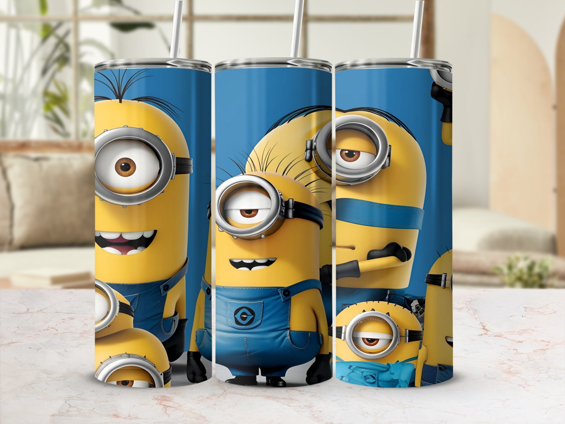 Three Minions from Despicable Me on blue tumblers with straws.