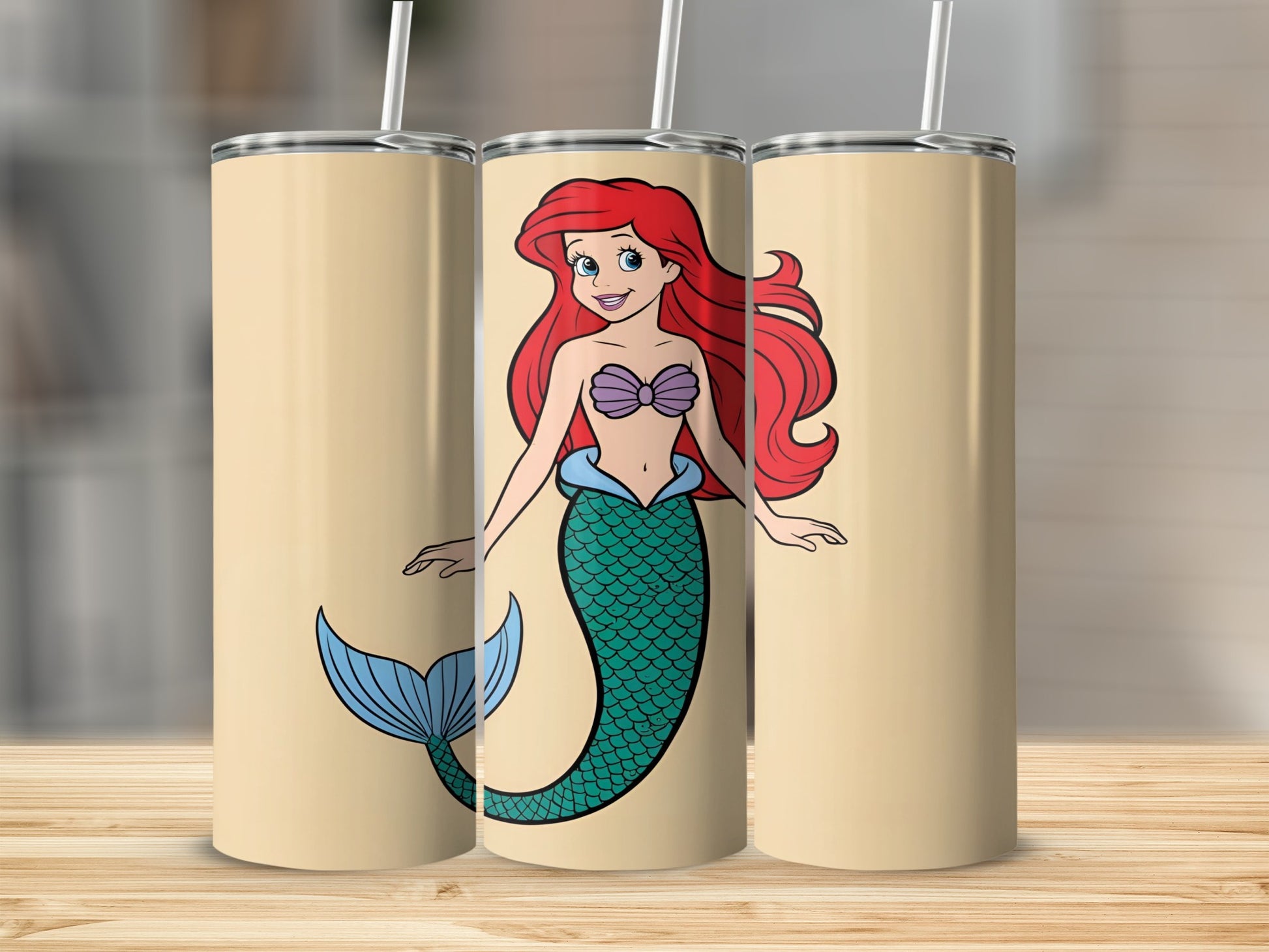 Ariel the Little Mermaid on a beige tumbler with a straw.