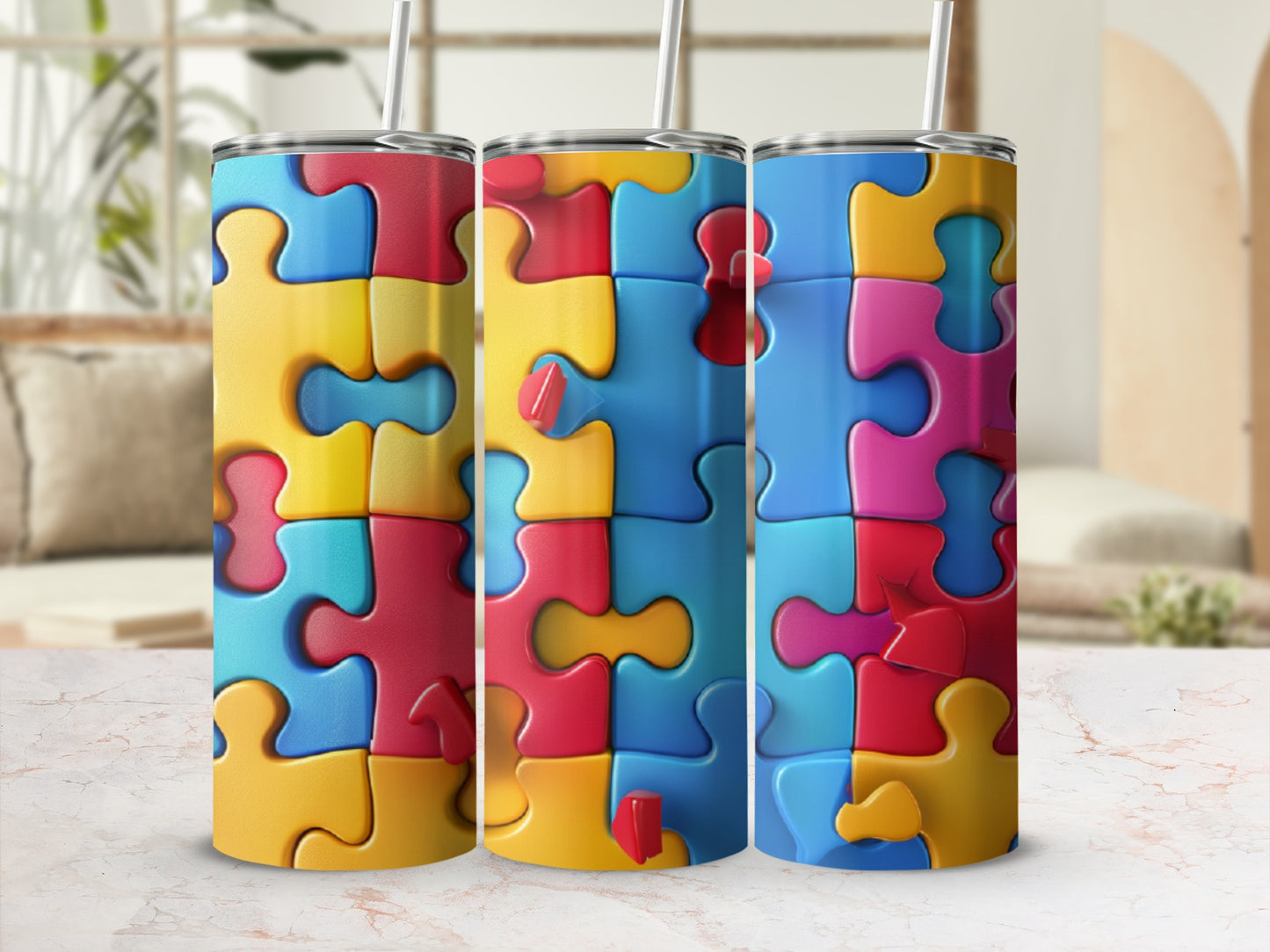 Three puzzle-themed tumblers with colorful puzzle pieces on a textured surface.