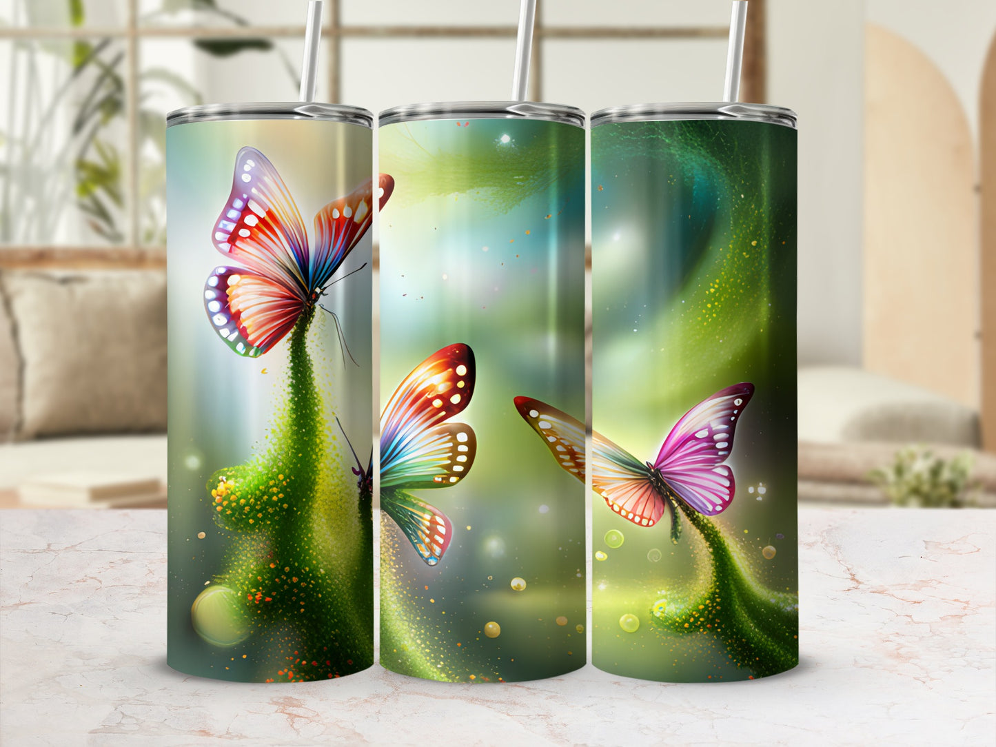 Three tumblers with colorful butterfly designs on a blurred background.
