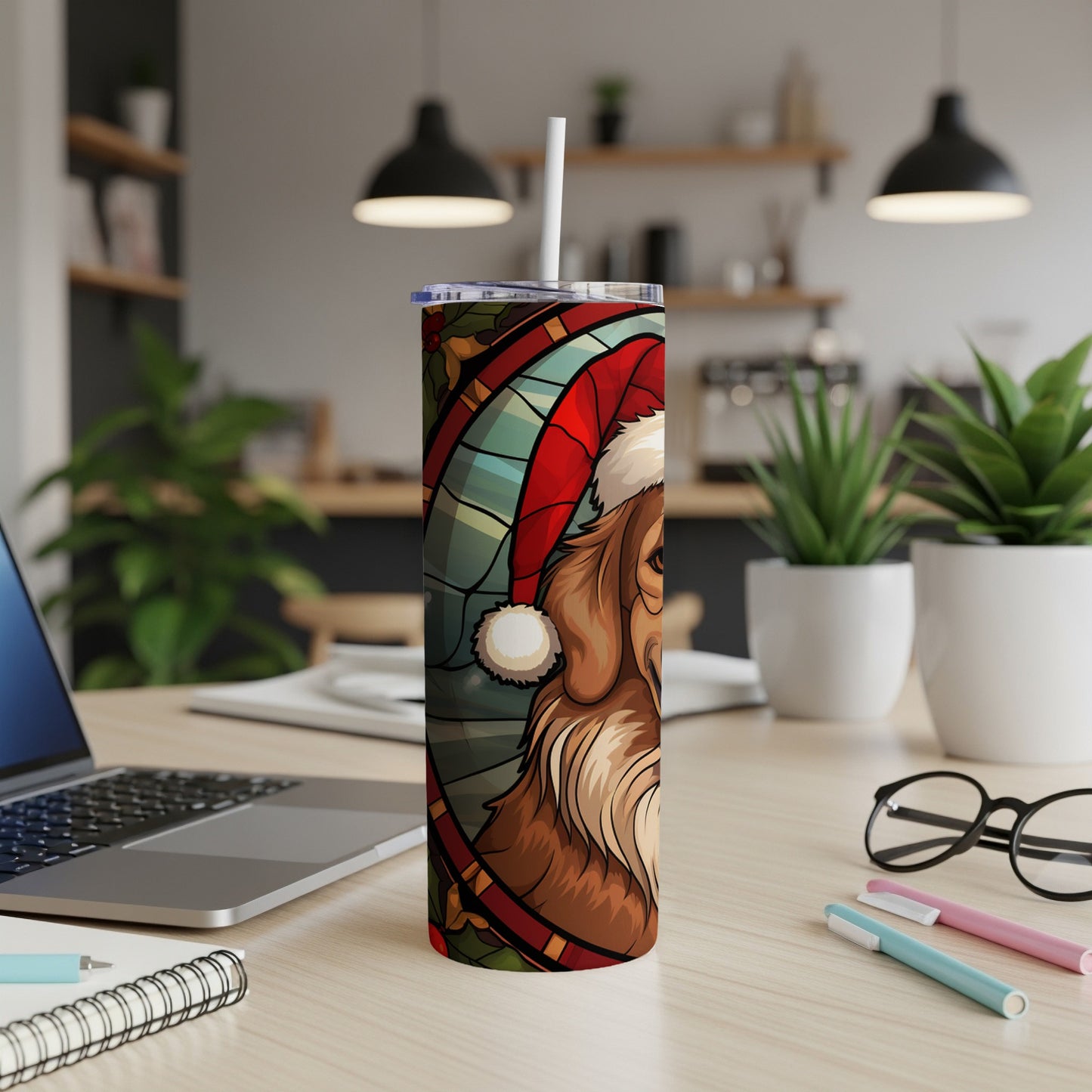 Santa hat-wearing dog illustration on a white tumbler with a straw.
