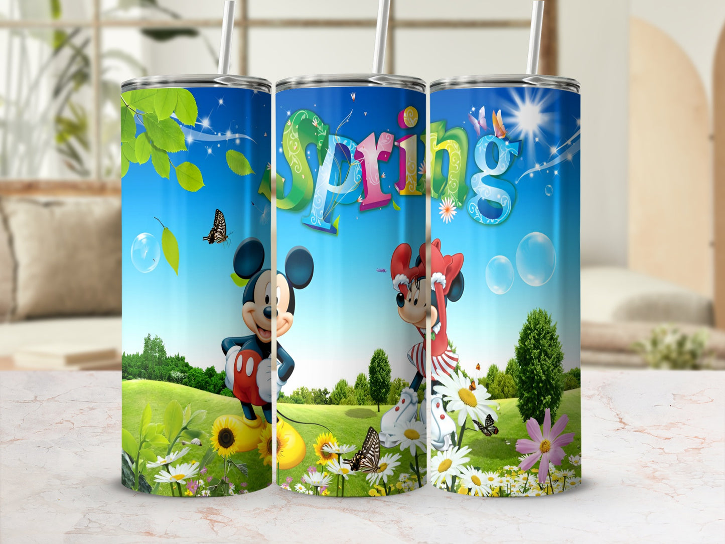 Three tumblers with Mickey Mouse and Minnie Mouse celebrating spring.