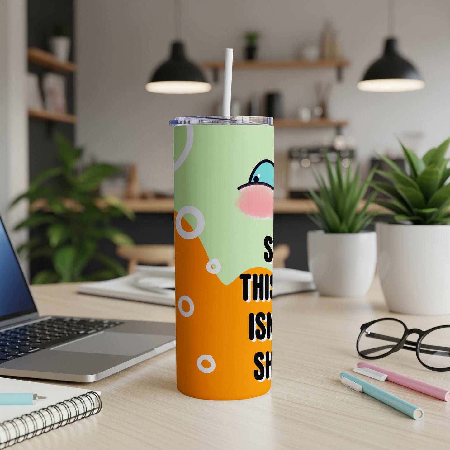Green and orange tumbler with cartoon face and text "THIS IS SO SMART".