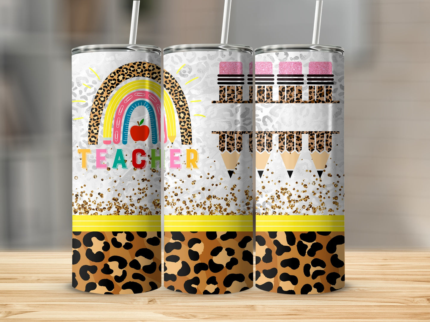 Teacher tumbler with rainbow, apples, and leopard print design.