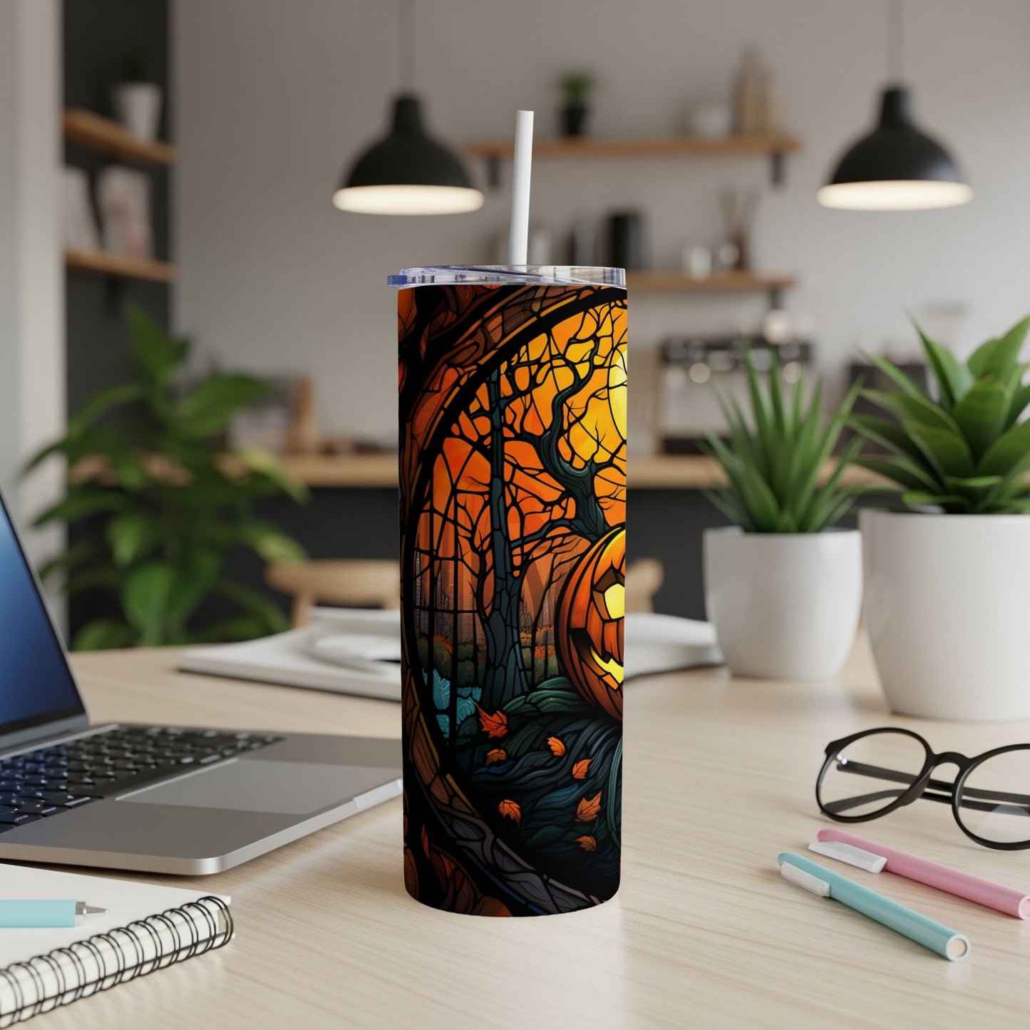 Tumbler with a Halloween pumpkin scene and forest illustration.