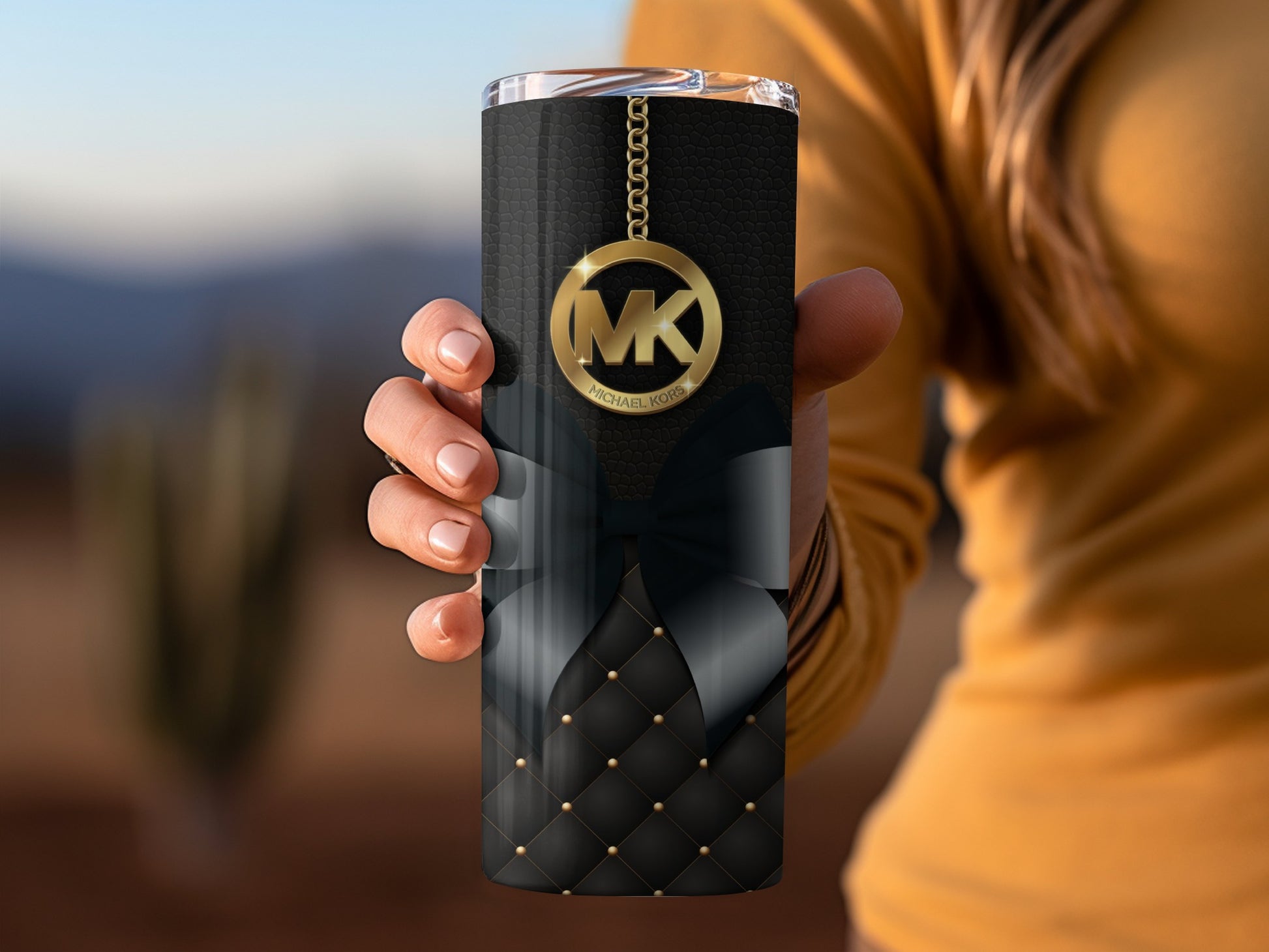 Elegant Black Tumbler with Gold Charm and Bow Design