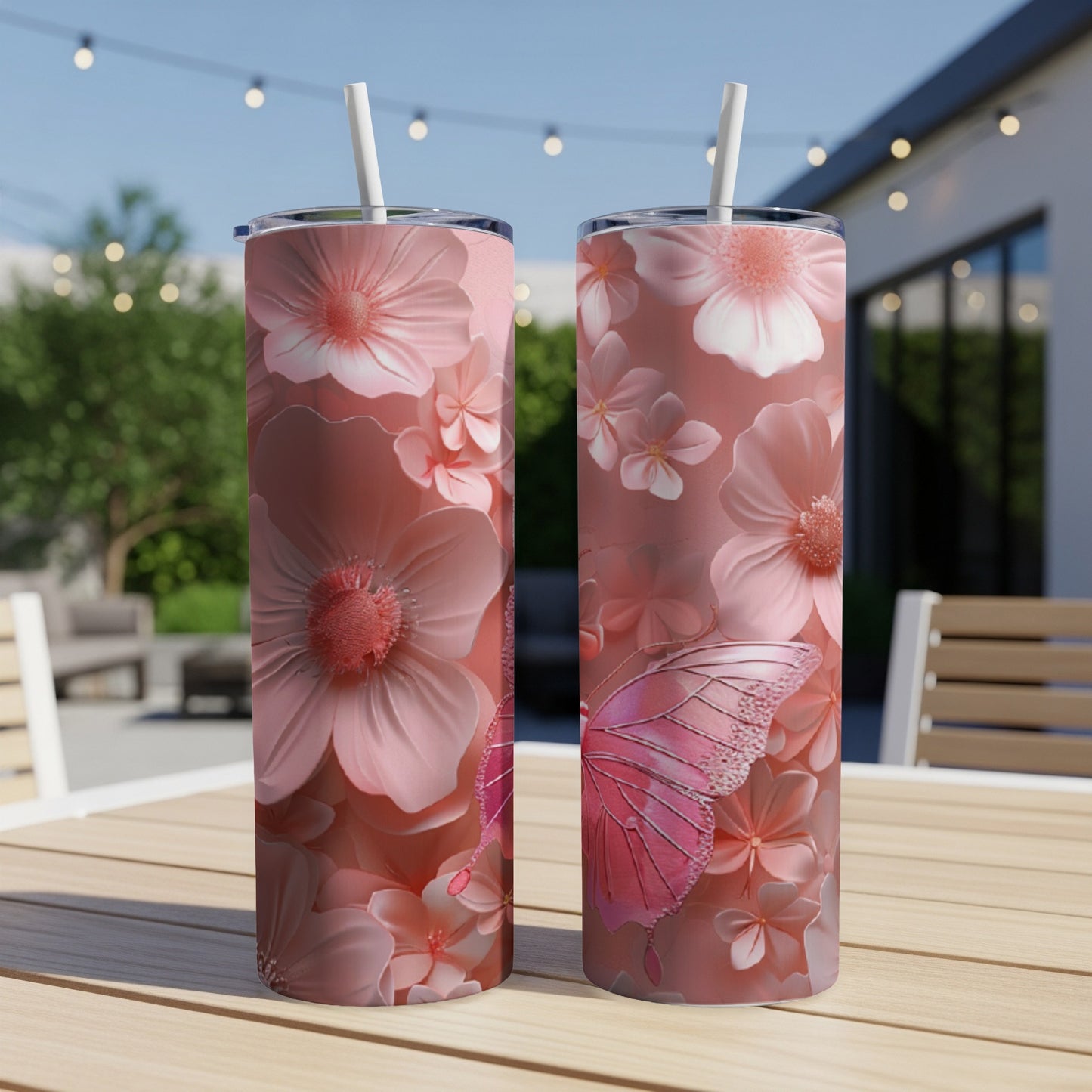 Two tall pink tumblers with floral and butterfly designs.