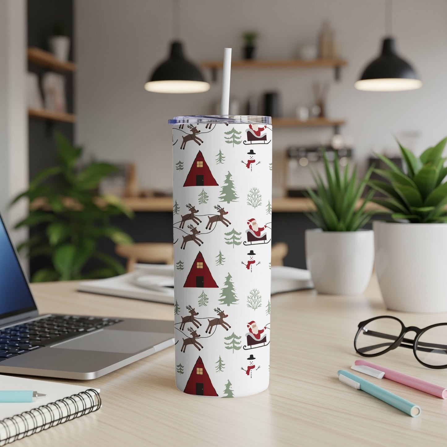 White tumbler with Santa, reindeer, snowman, and Christmas tree pattern.