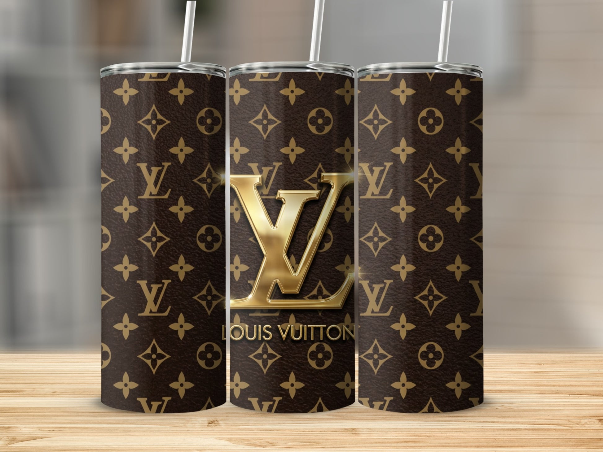 Three tumblers with Louis Vuitton logo and repeating monogram pattern.