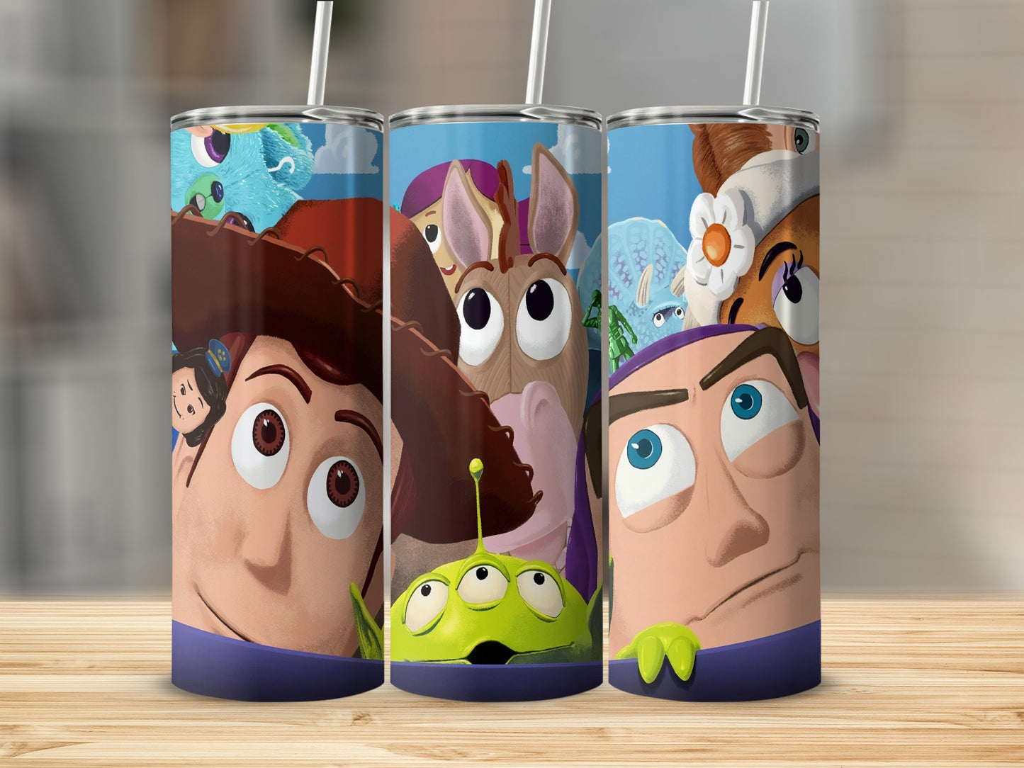 Woody, Buzz Lightyear, and Alien from Toy Story on three tumblers.